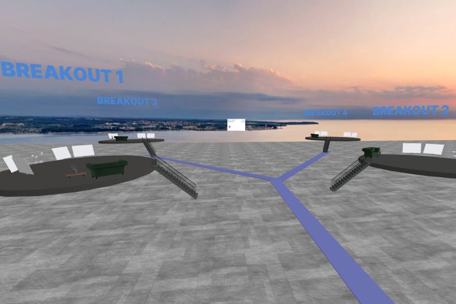 A VR workshop space set up for breakout meetings with whiteboards and 3D tools