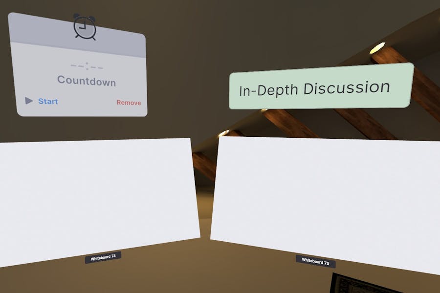 Two whiteboards, a timer and text label to improve collaboration in the workplace during a virtual reality business meeting.