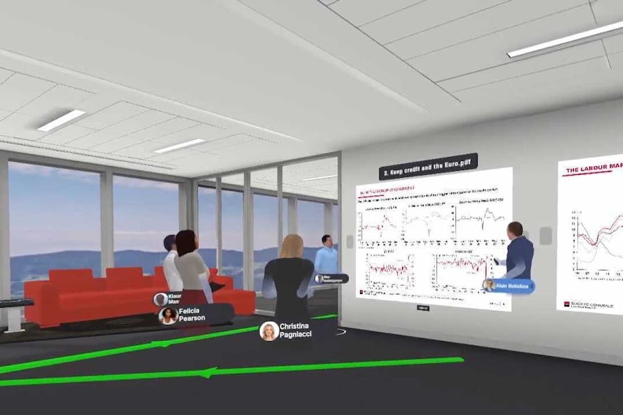 Avatars of a group of clients and company representatives discussing a presentation in Arthur VR meeting space