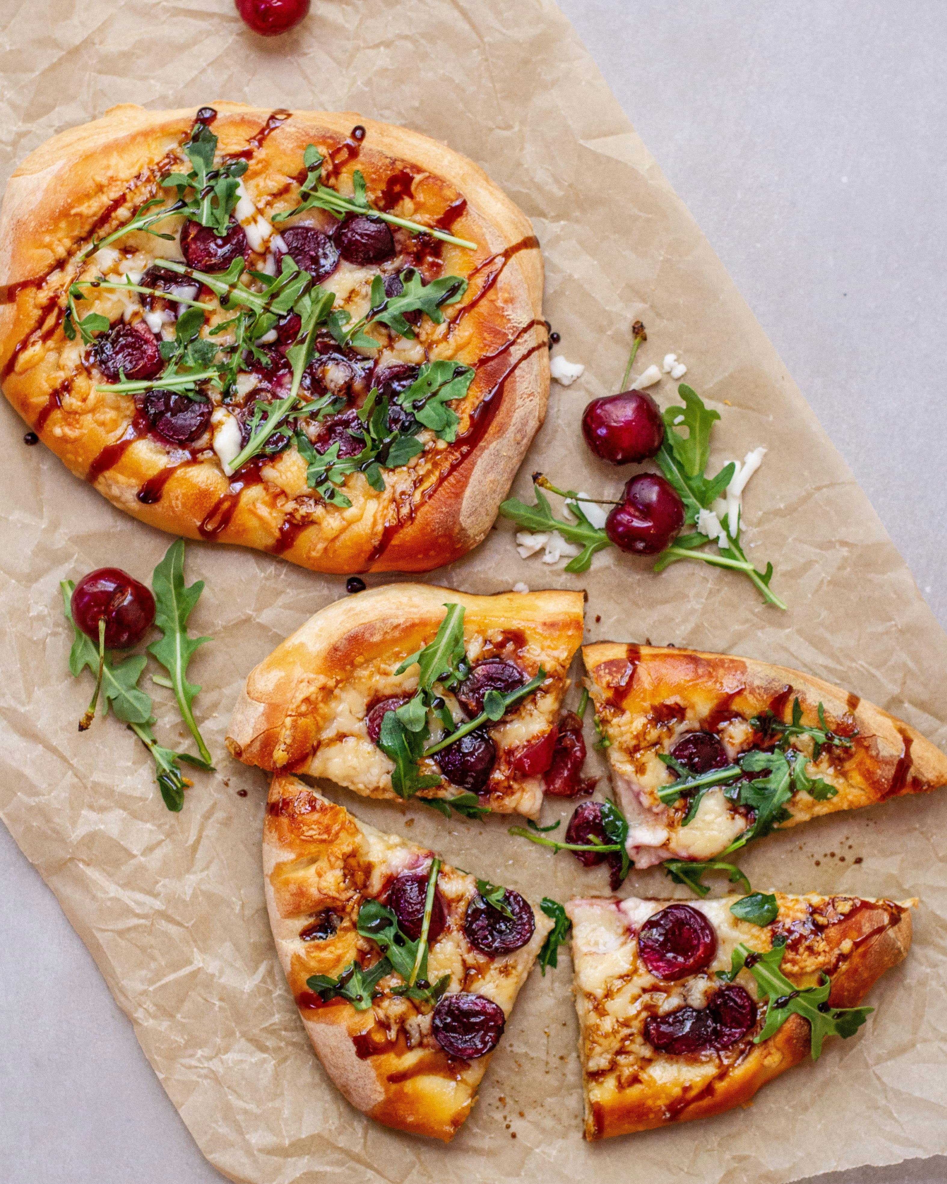 cherry goat arugula pizza