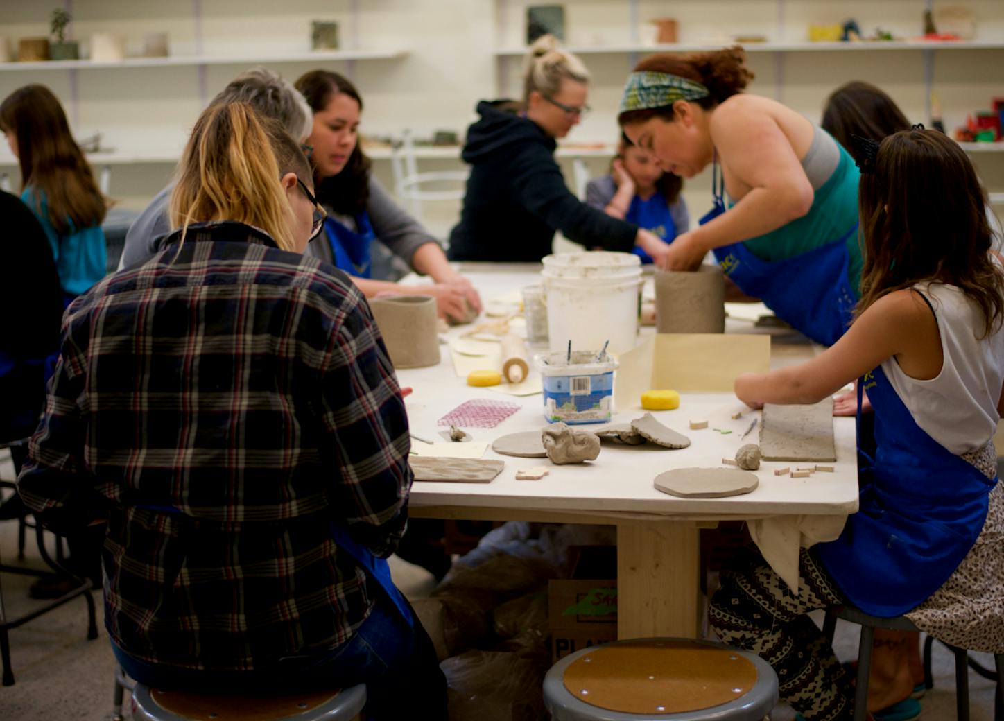 people working with clay