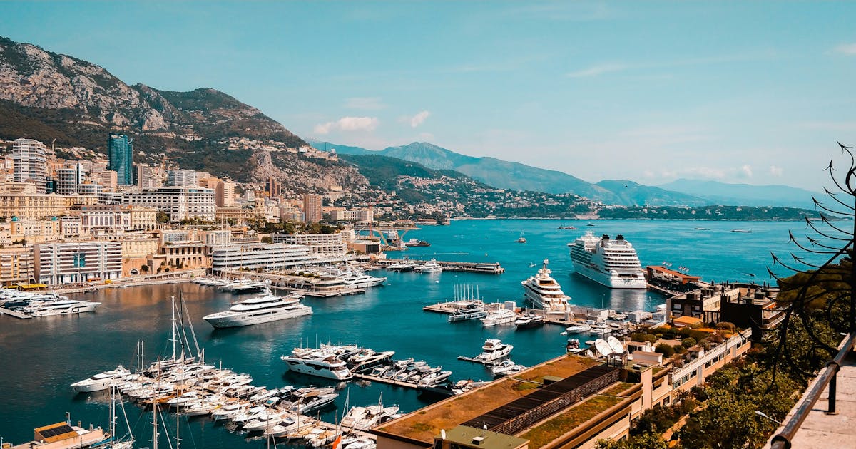 Beautiful view of Monte Carlo. Yachts and boats can be seen in the harbour.