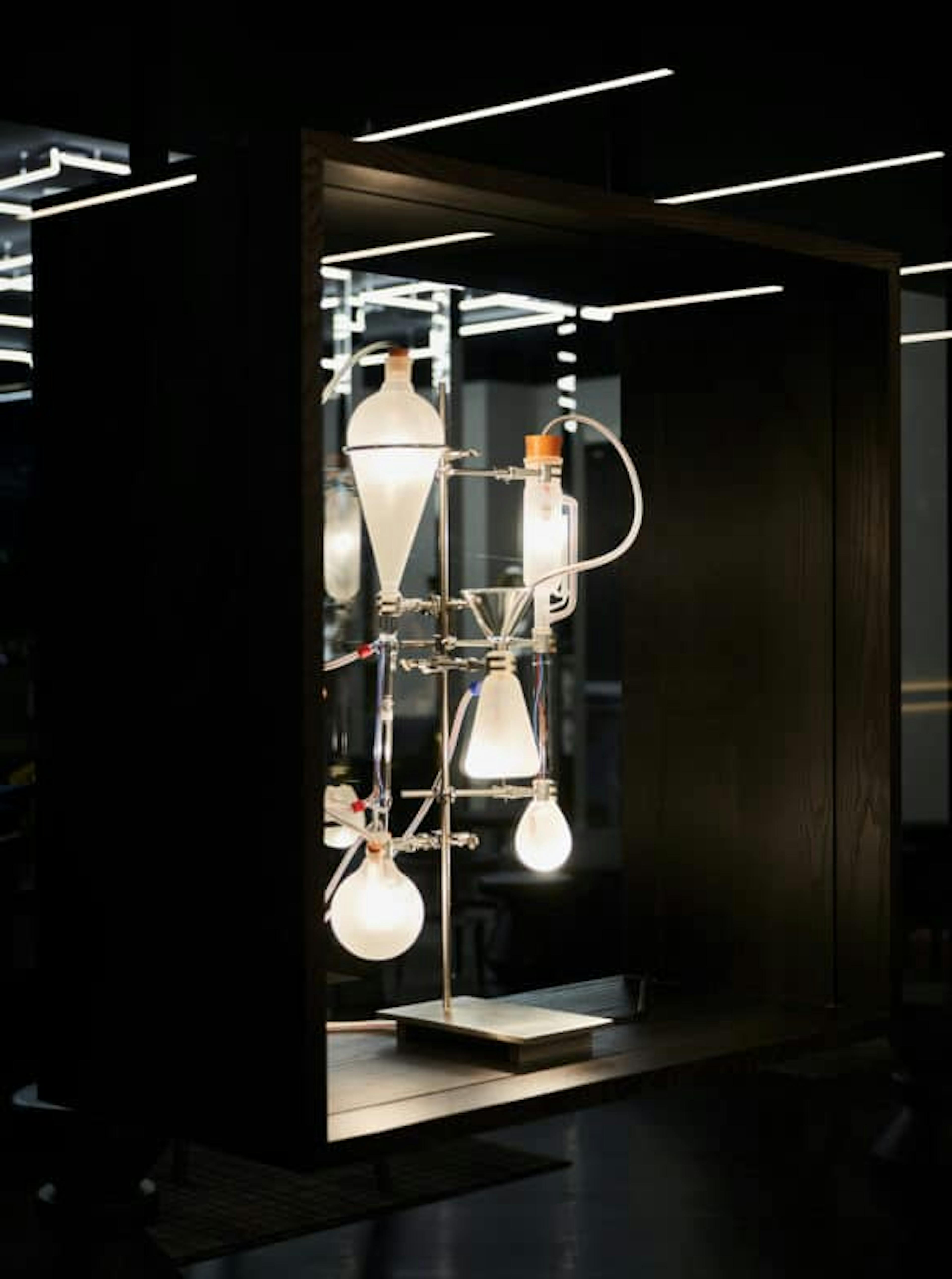 A chemistry lamp with a wooden box frame.