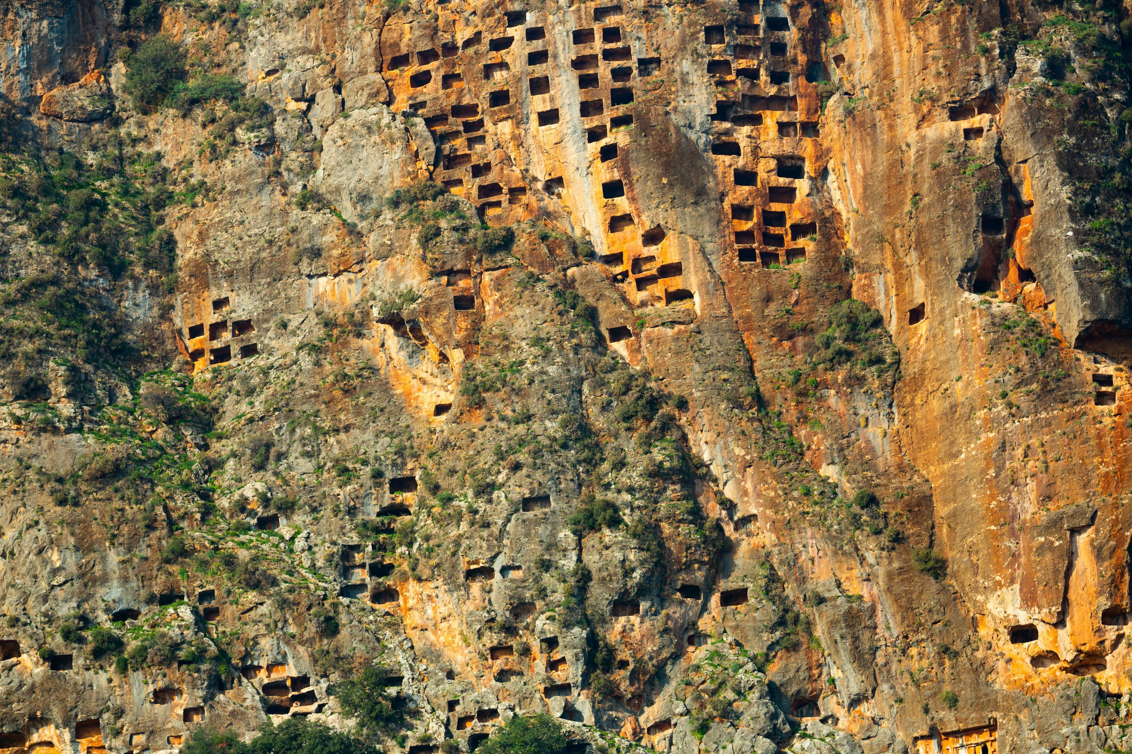 The unique tombs carved into the cliff called the Pinara Honeycomb tombs.