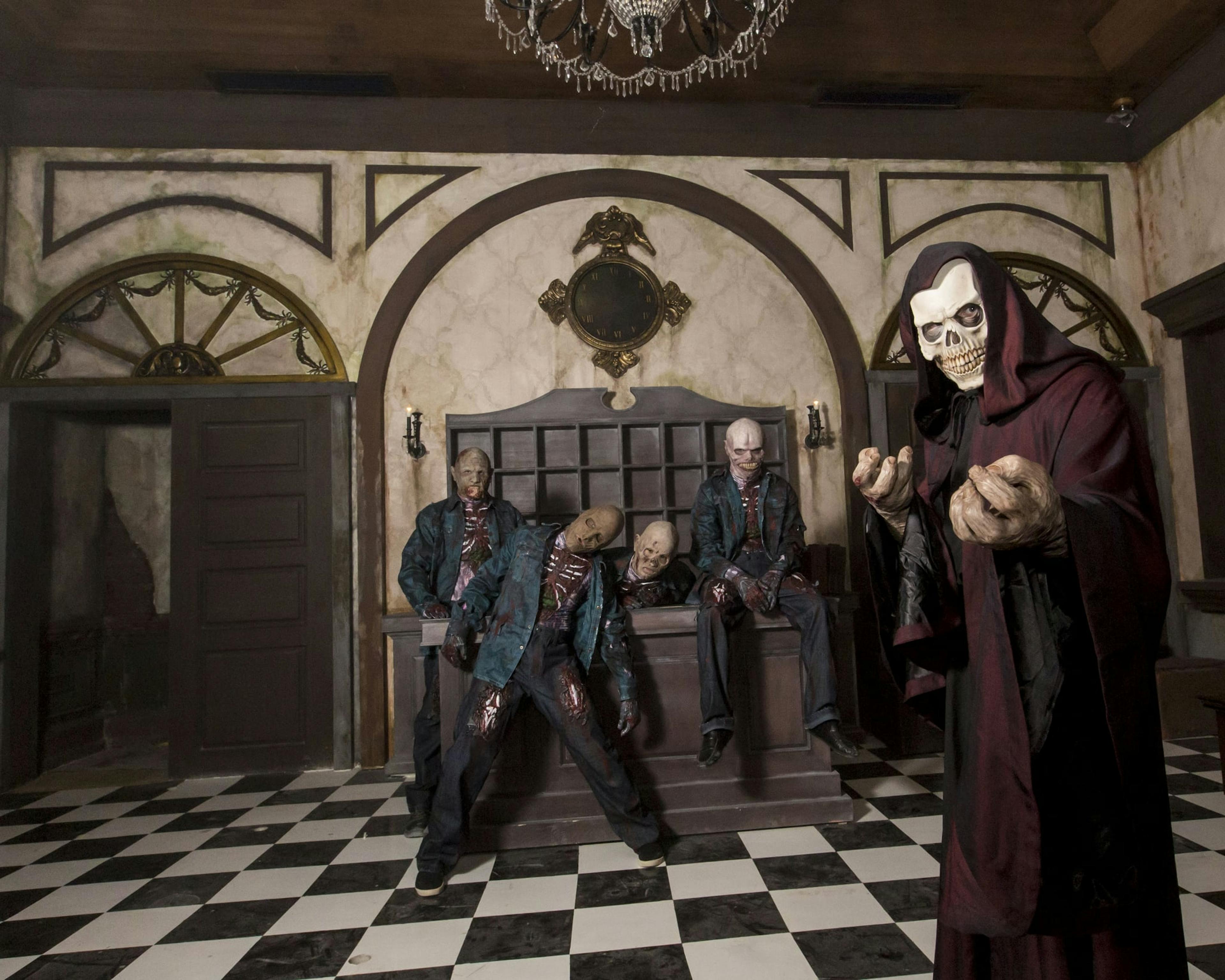 Room of checkered floor tiles with haunted mannnequins.
