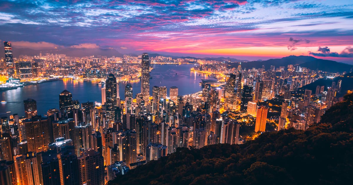 Beautiful picture of the sun setting over the skyscrapers in Hong Kong