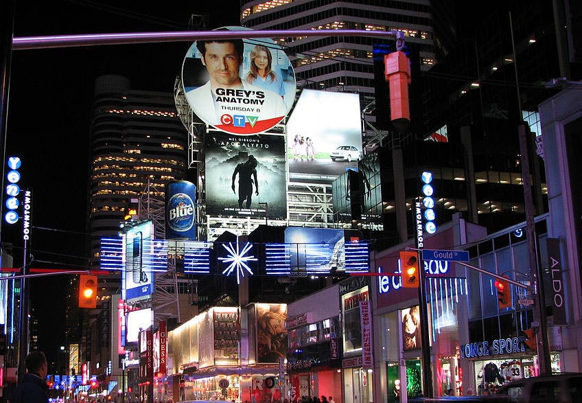 Billboards in downtown area that advertise businesses.