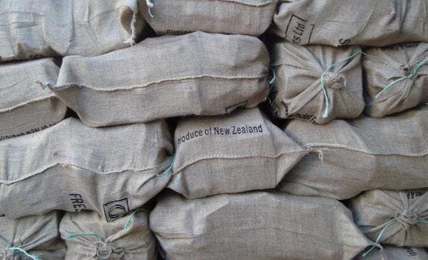 firewood is bagged in natural hessian cloth sacks