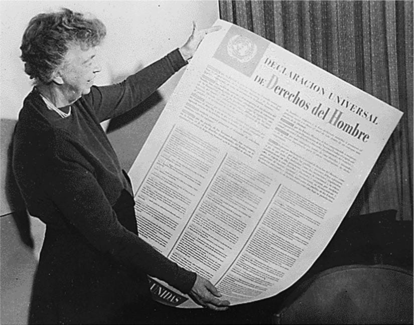 Eleanor Roosevelt is pictured holding the Universal Declaration of Human Rights in Spanish, a highly influential document that she helped create.