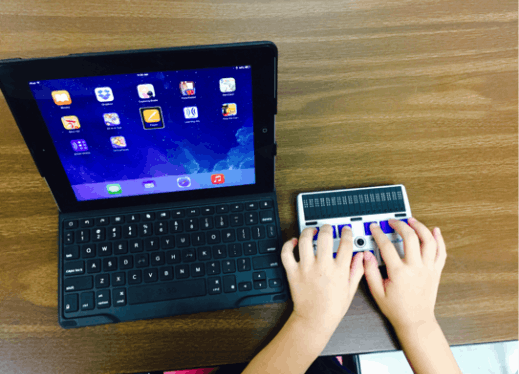 This computer is connected with a refreshable braille display that is powered by a screen reader.