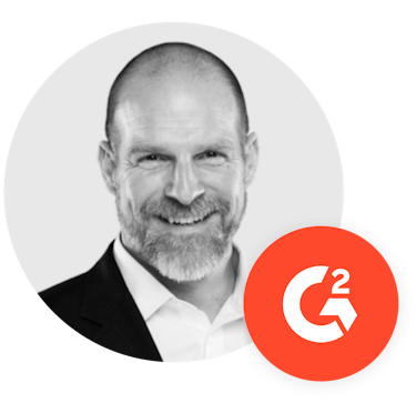 Headshot of Eric with a G2 logo