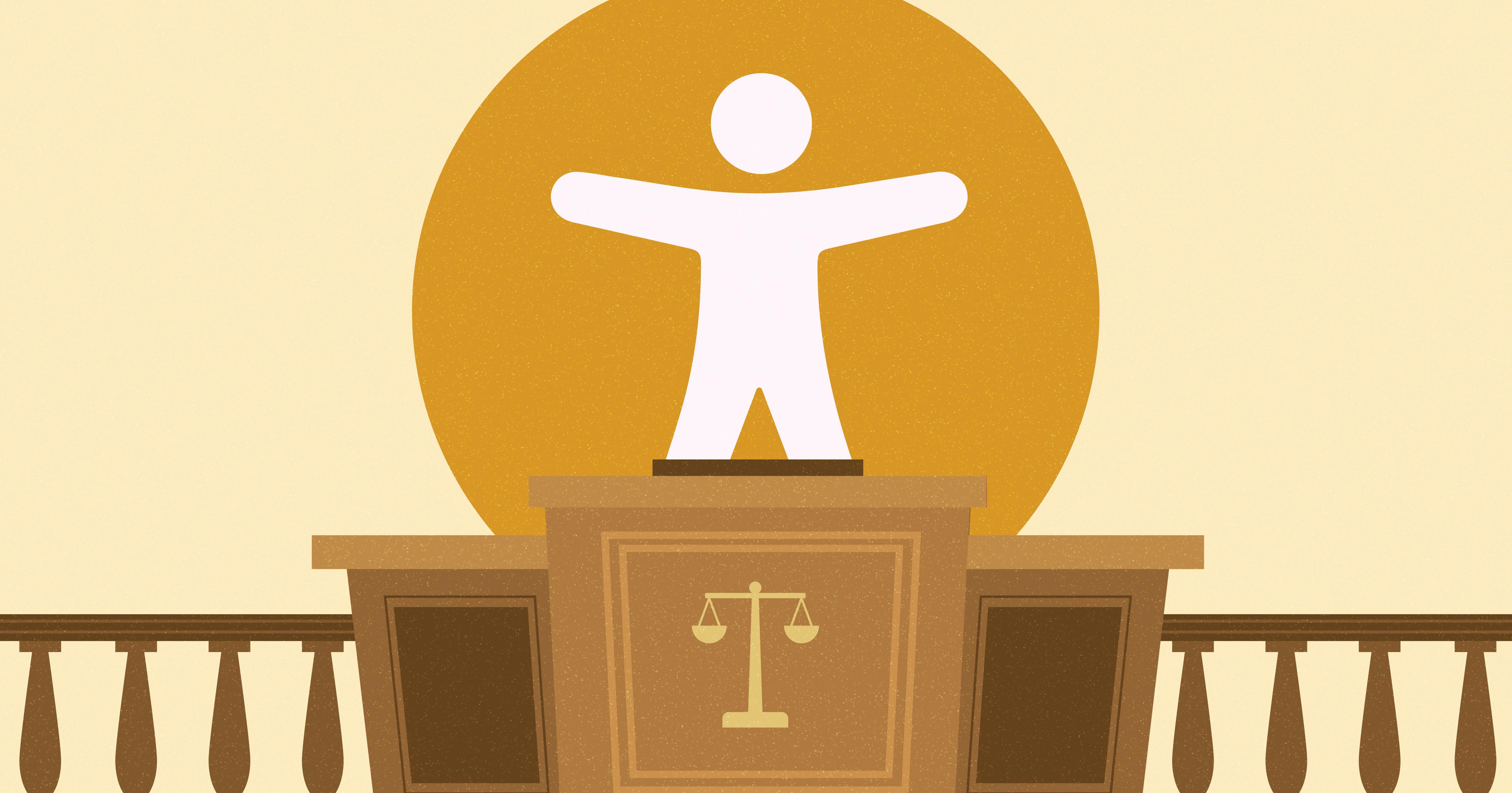 Judge's podium with a balanced scale on the front and a large accessibility symbol on top. 