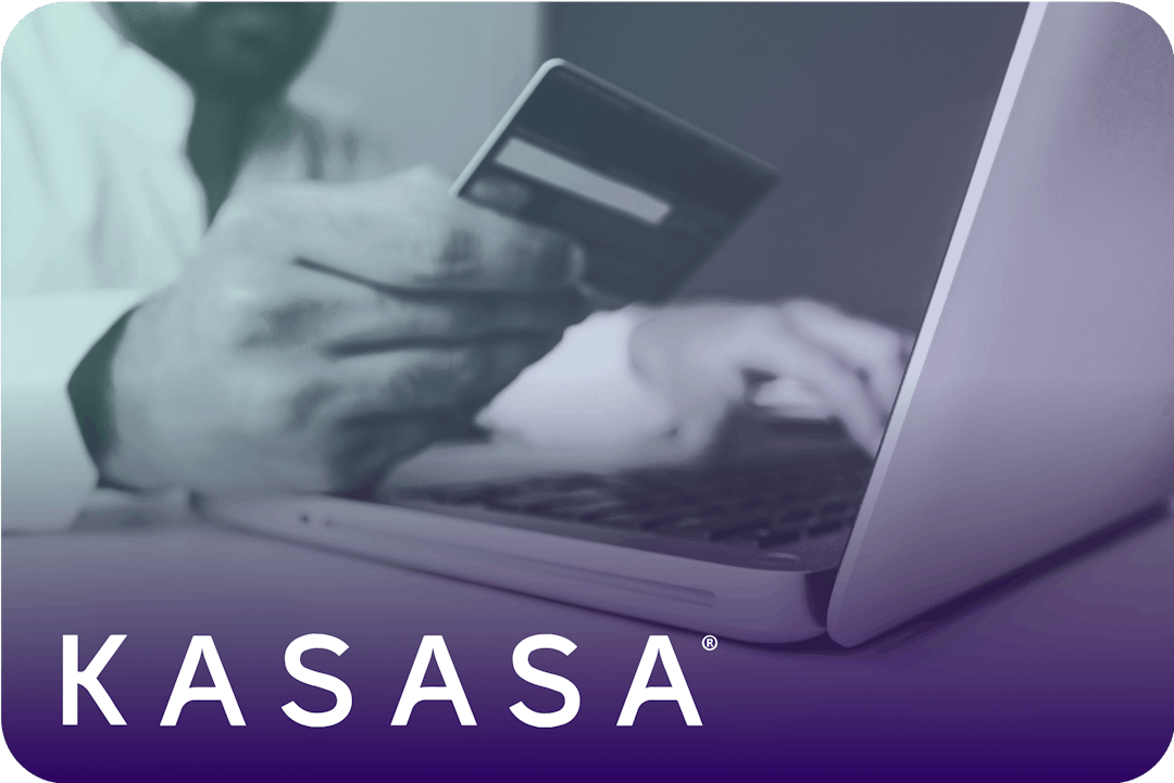A man holding a credit card with his right hand and typing on a laptop with his left hand with the Kasasa logo on top.