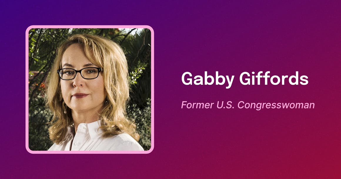 Framed photo of Gabby Giffords, a white woman with shoulder-length light brown hair, wearing dark-rimmed glasses, smiling. Text reads "Gabby Giffords. Former U.S. Congresswoman."