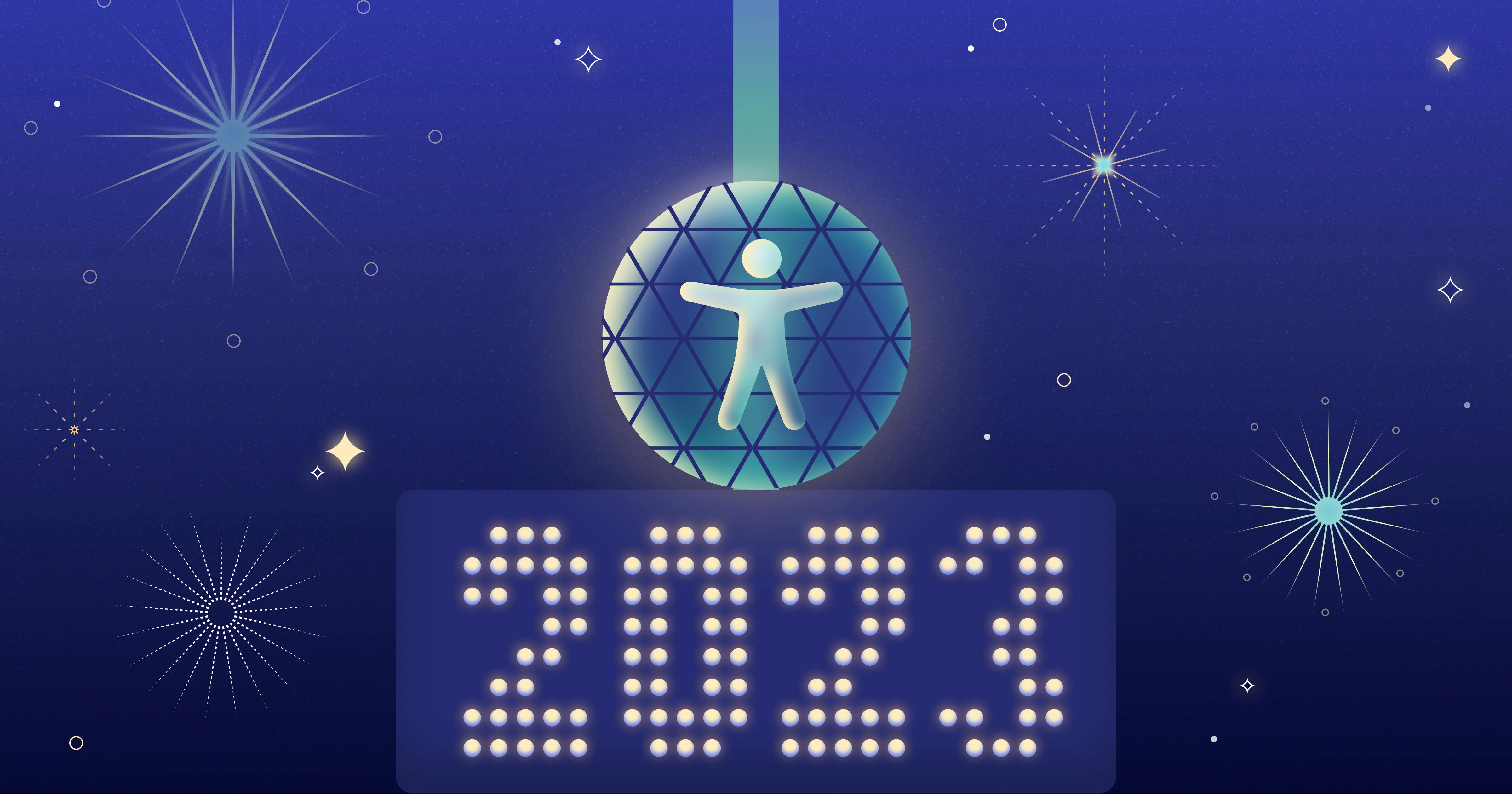 An accessibility symbol in the middle of a shiny disco ball, surrounded by fireworks. Beneath the disco ball, lightbulbs spell out 2023.