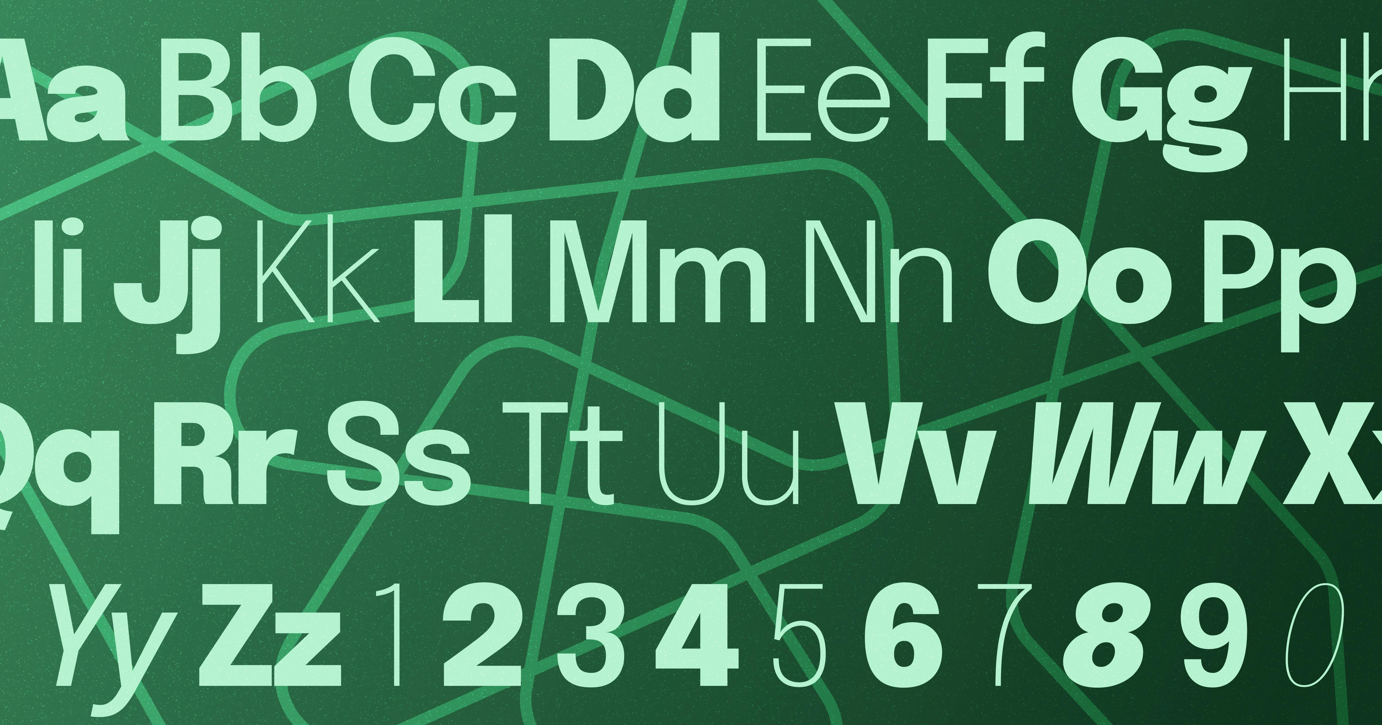 Alphabet in a variety of fonts with jagged lines behind it.
