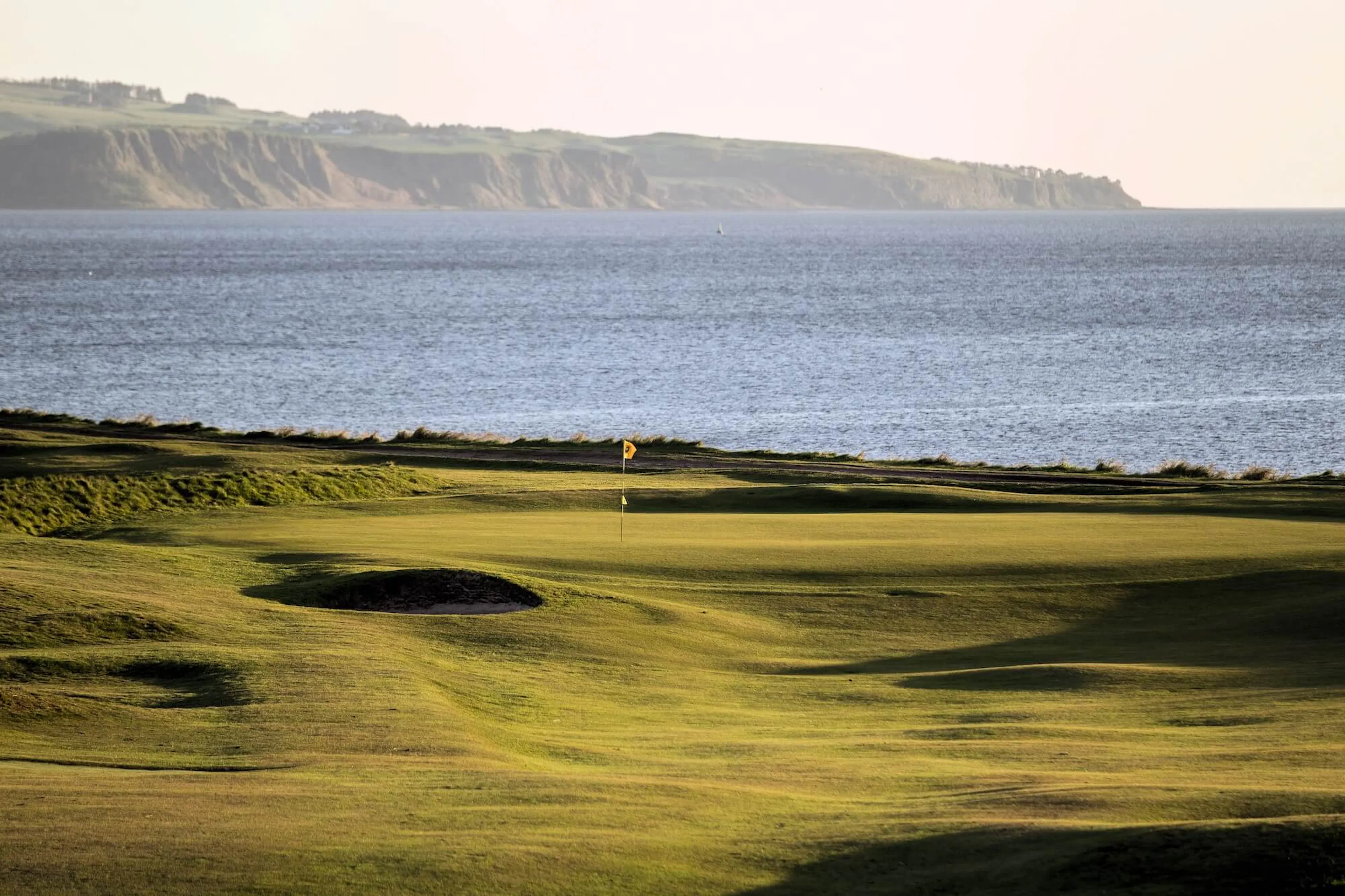 Looking down the 6th hole at Prestwick St. Nicholas’ Golf Club, with stunning views over the Firth of Clyde and the Isle of Arran in the distance.
