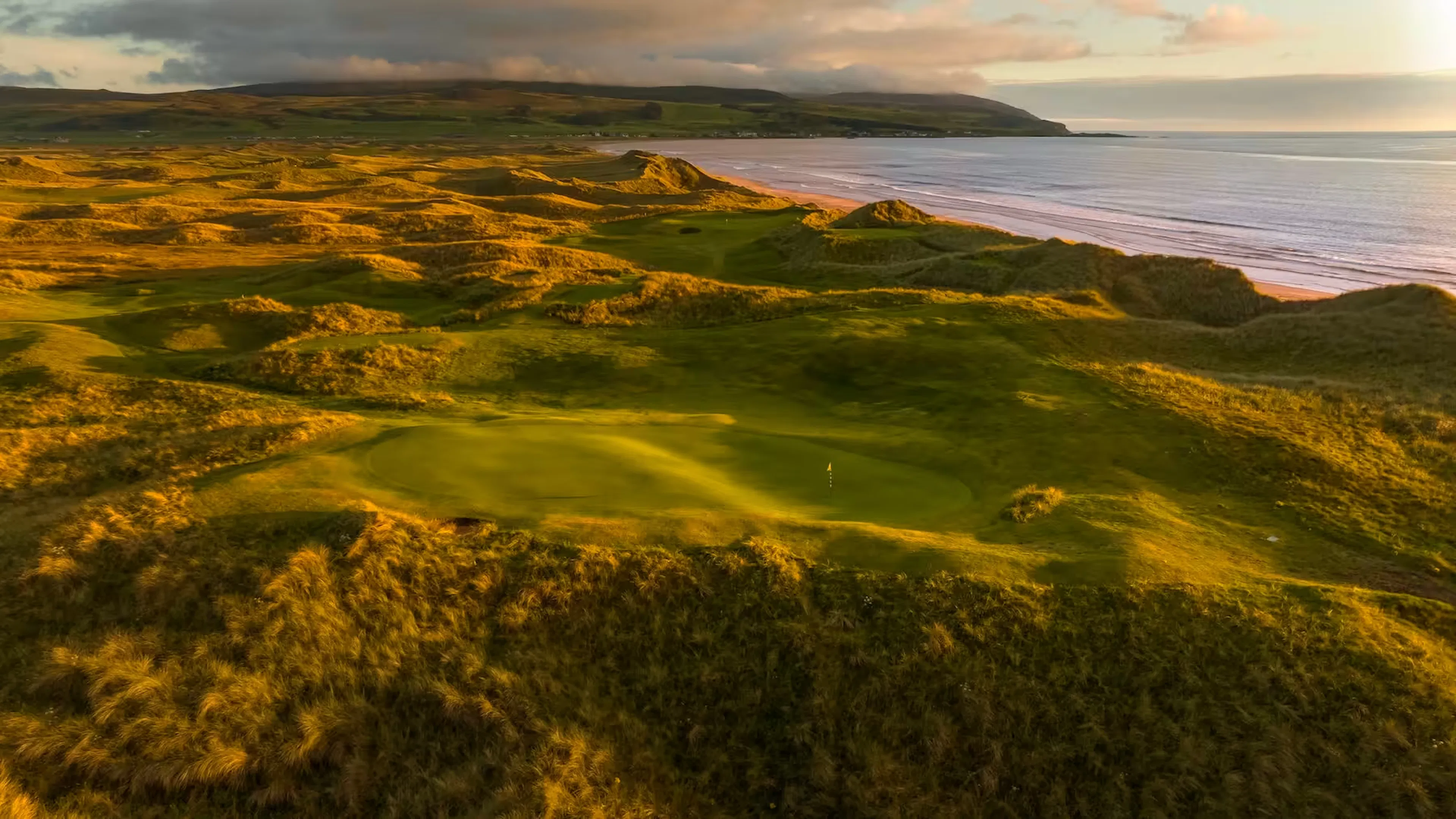 Sunlight over the 6th hole at Machrihanish Dunes on the Kintyre Peninsular 