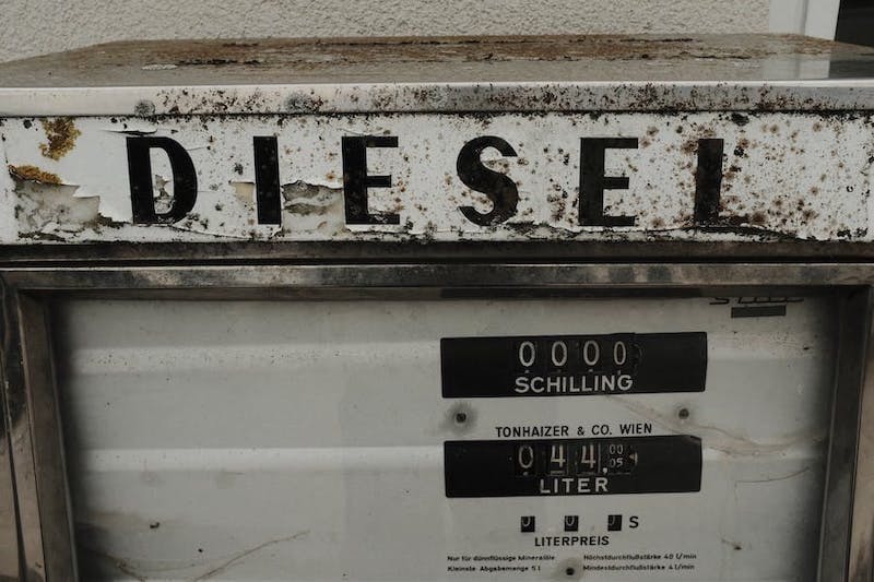 An old, rusted diesel fuel pump