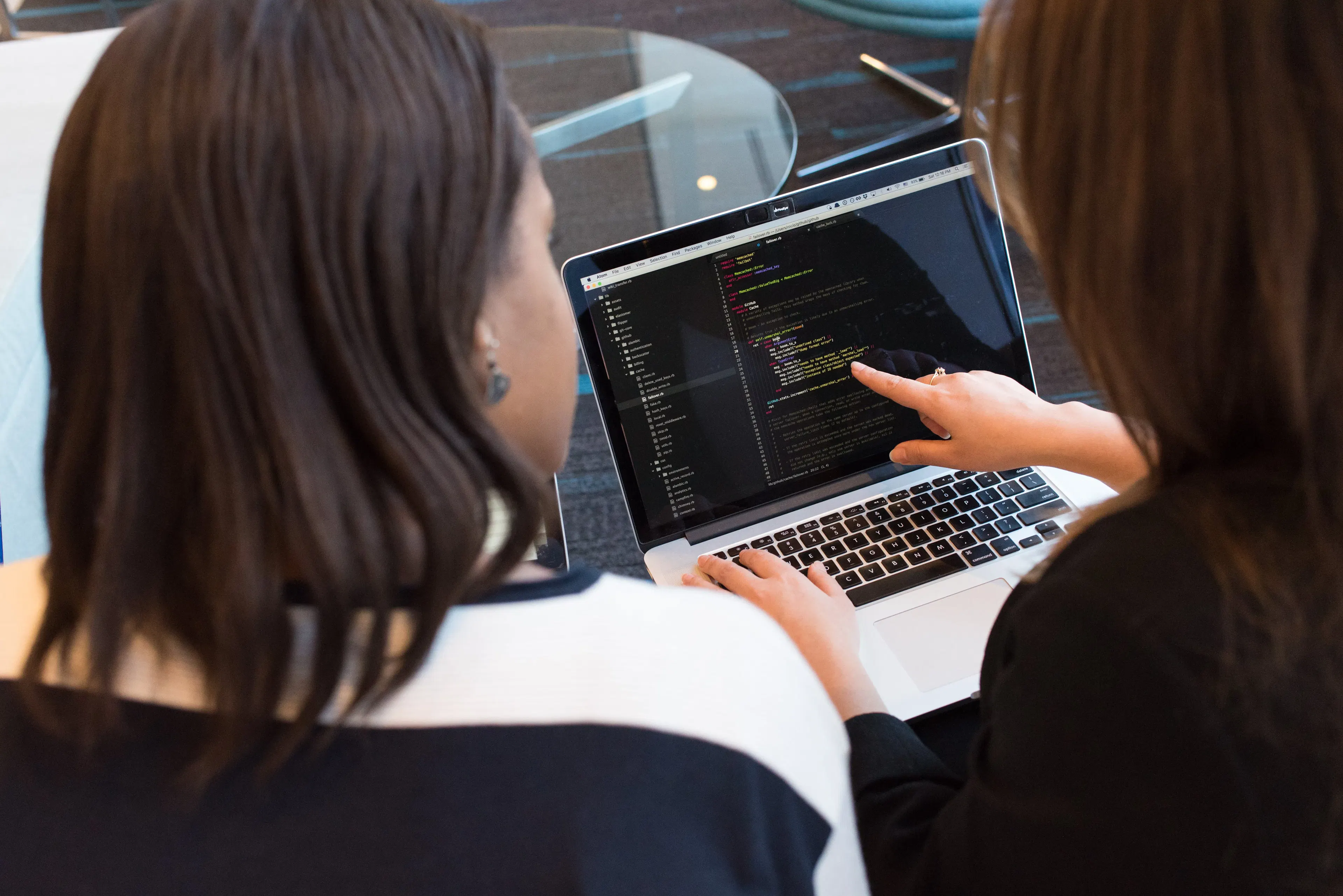 AI technology professional working on software project in modern office