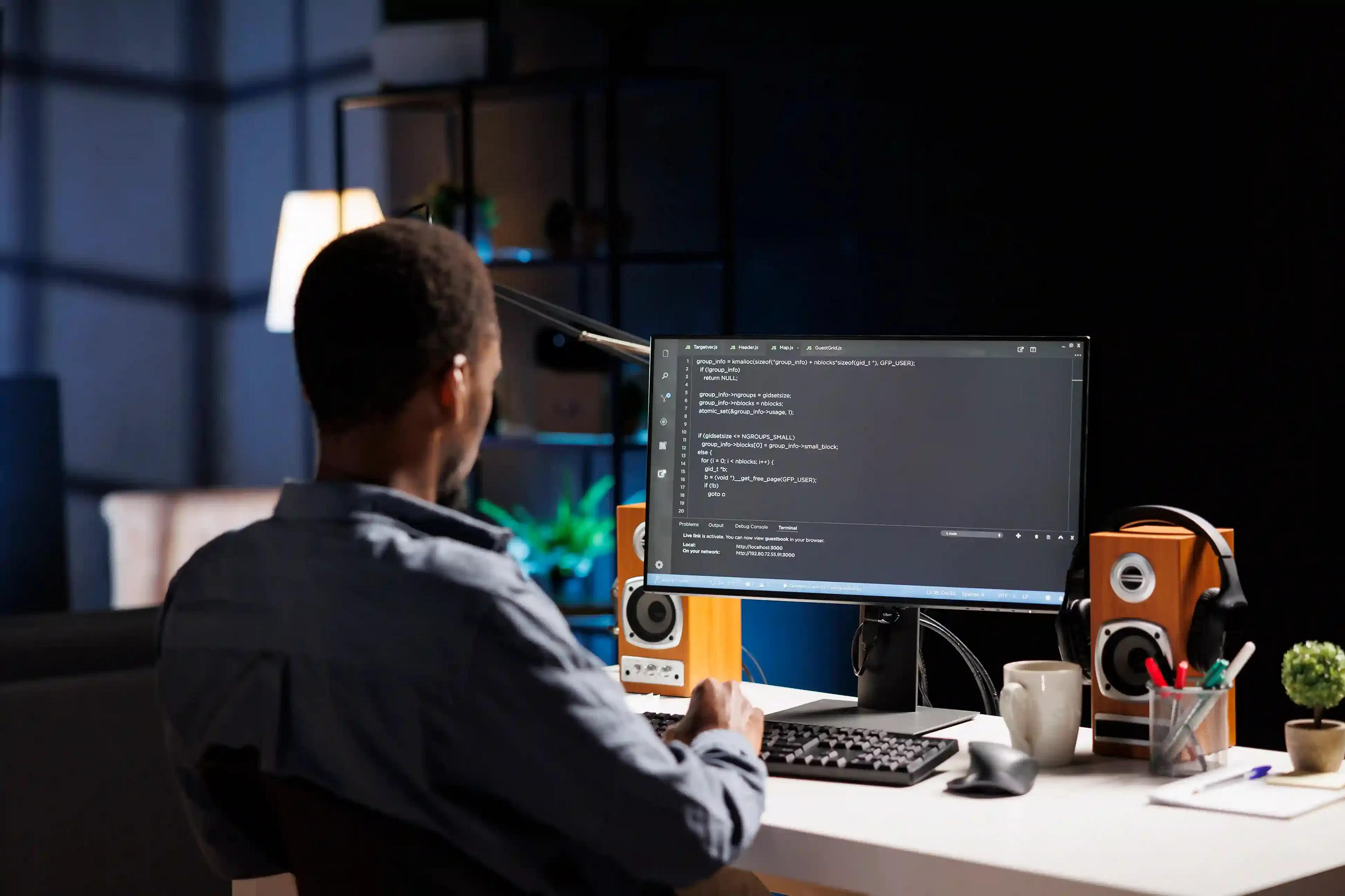 male developer entering binary data in terminal panel