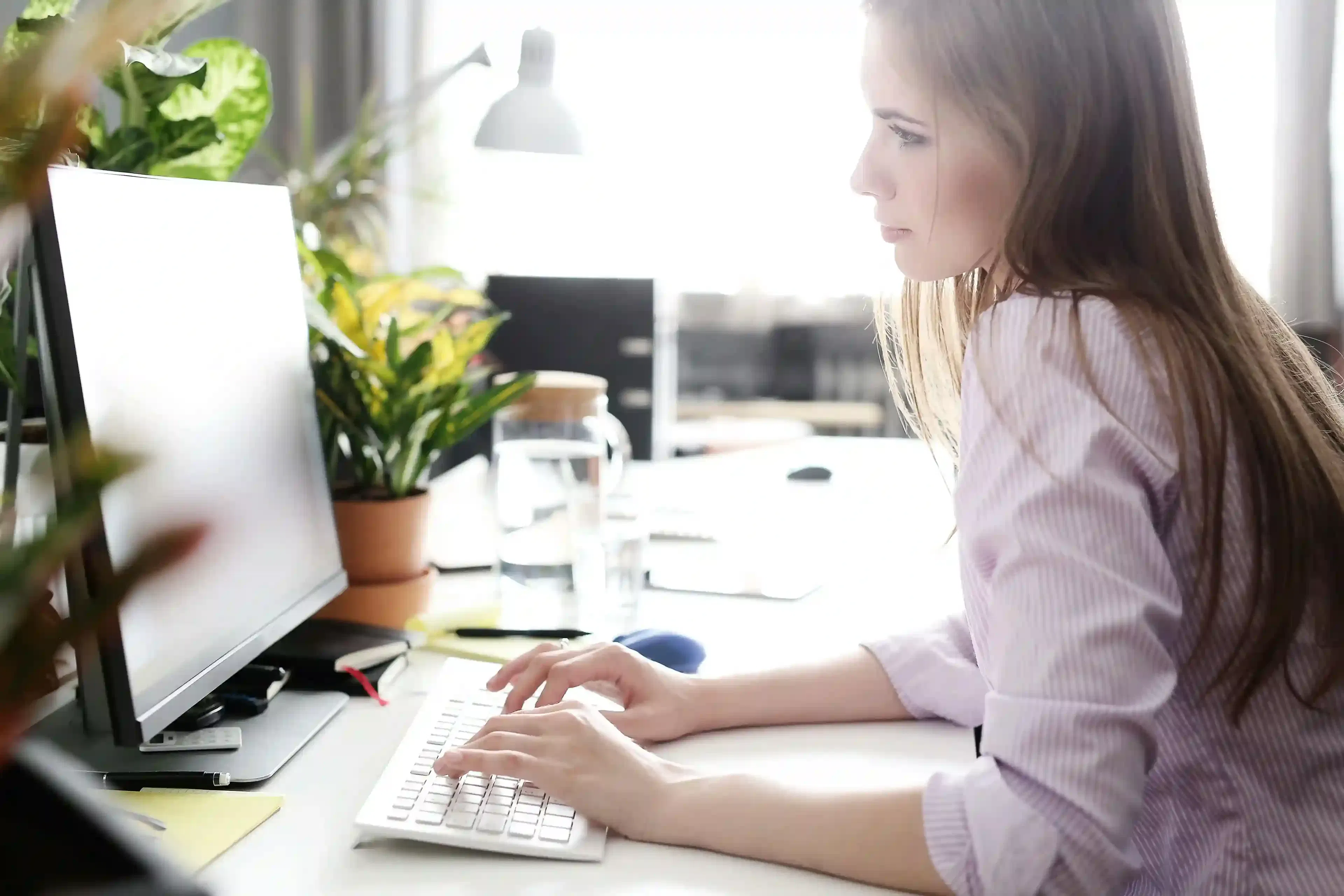woman working at modern office with technology tools