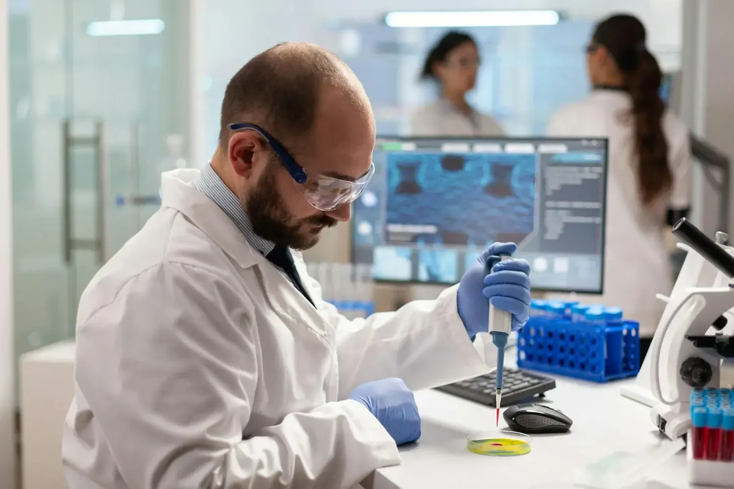 AI technology professional working on software project in modern office