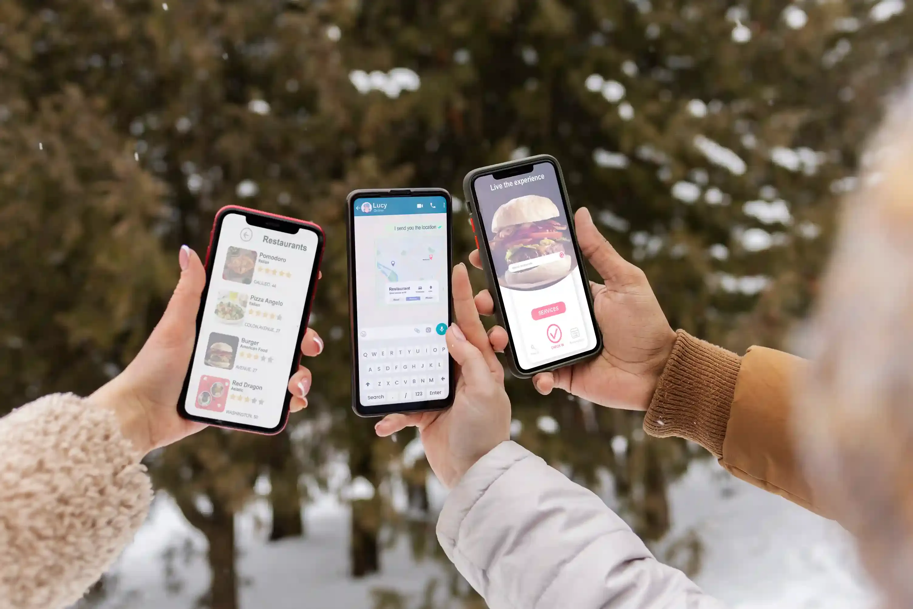 high-angle view of friends holding smartphones for app