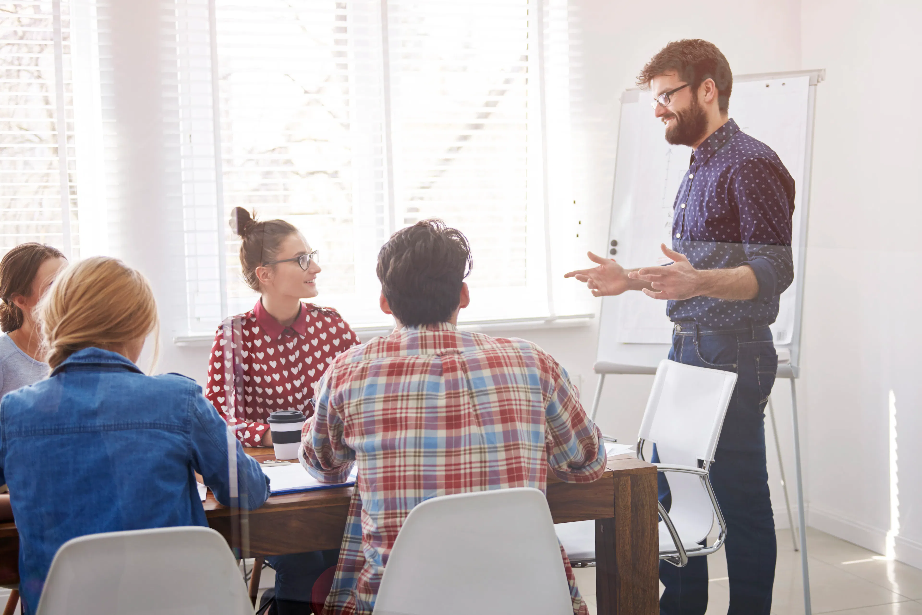 executive presenting digital strategy to tech team