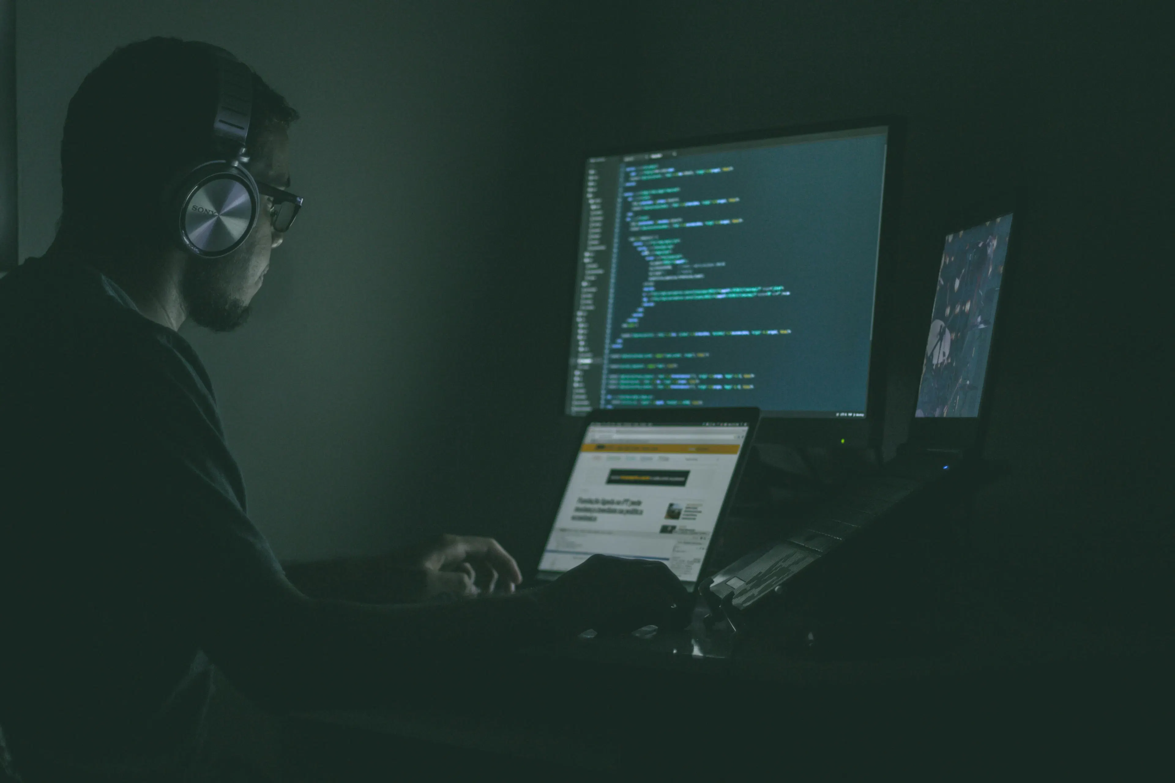 software developer working at modern computer setup