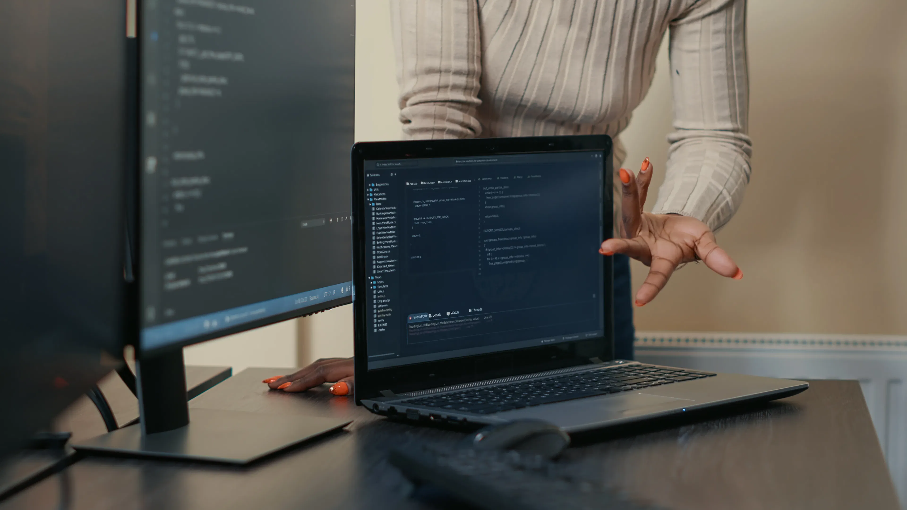 laptop running code algorithm in team software project