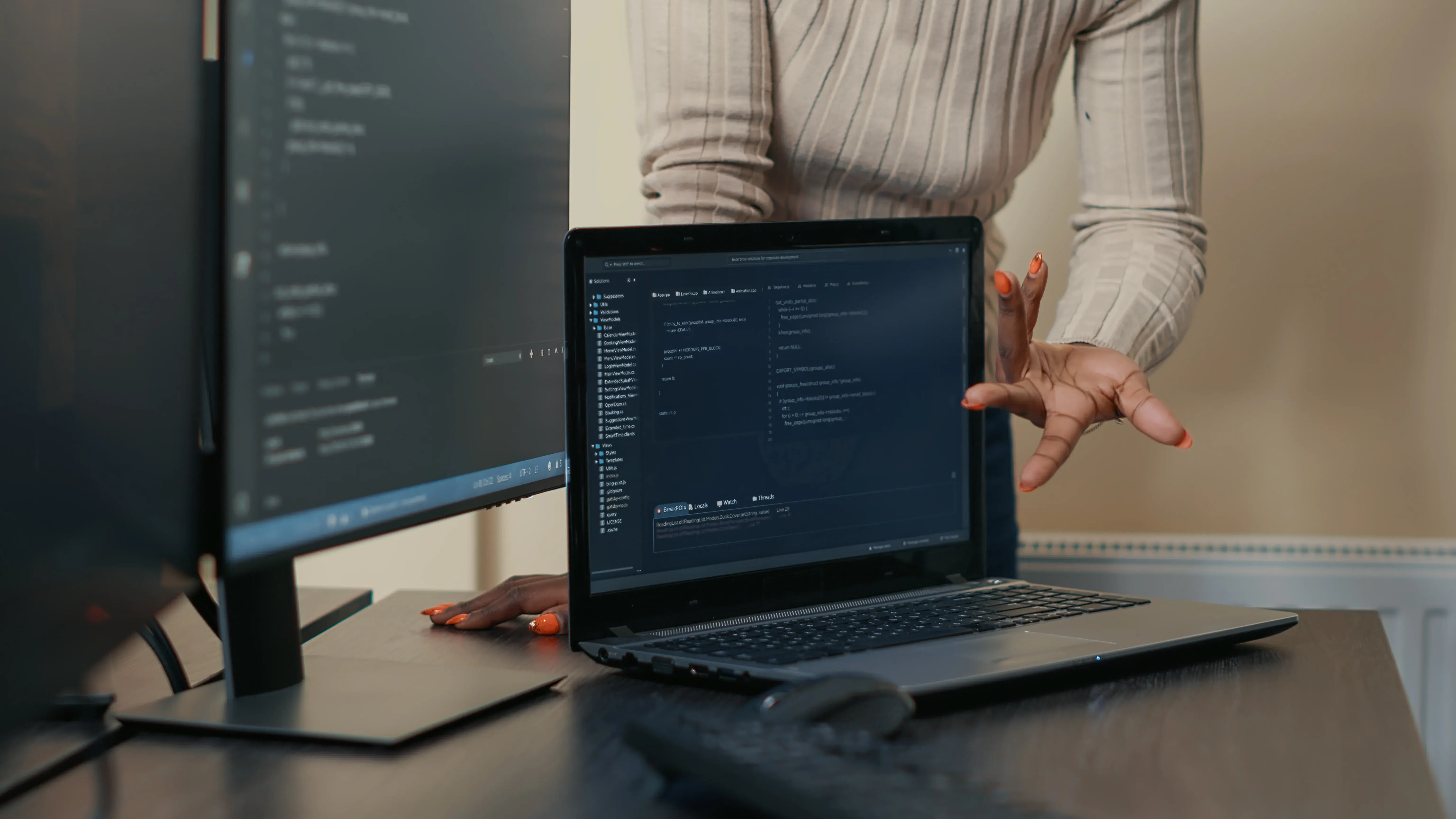 laptop running code algorithm in team software project