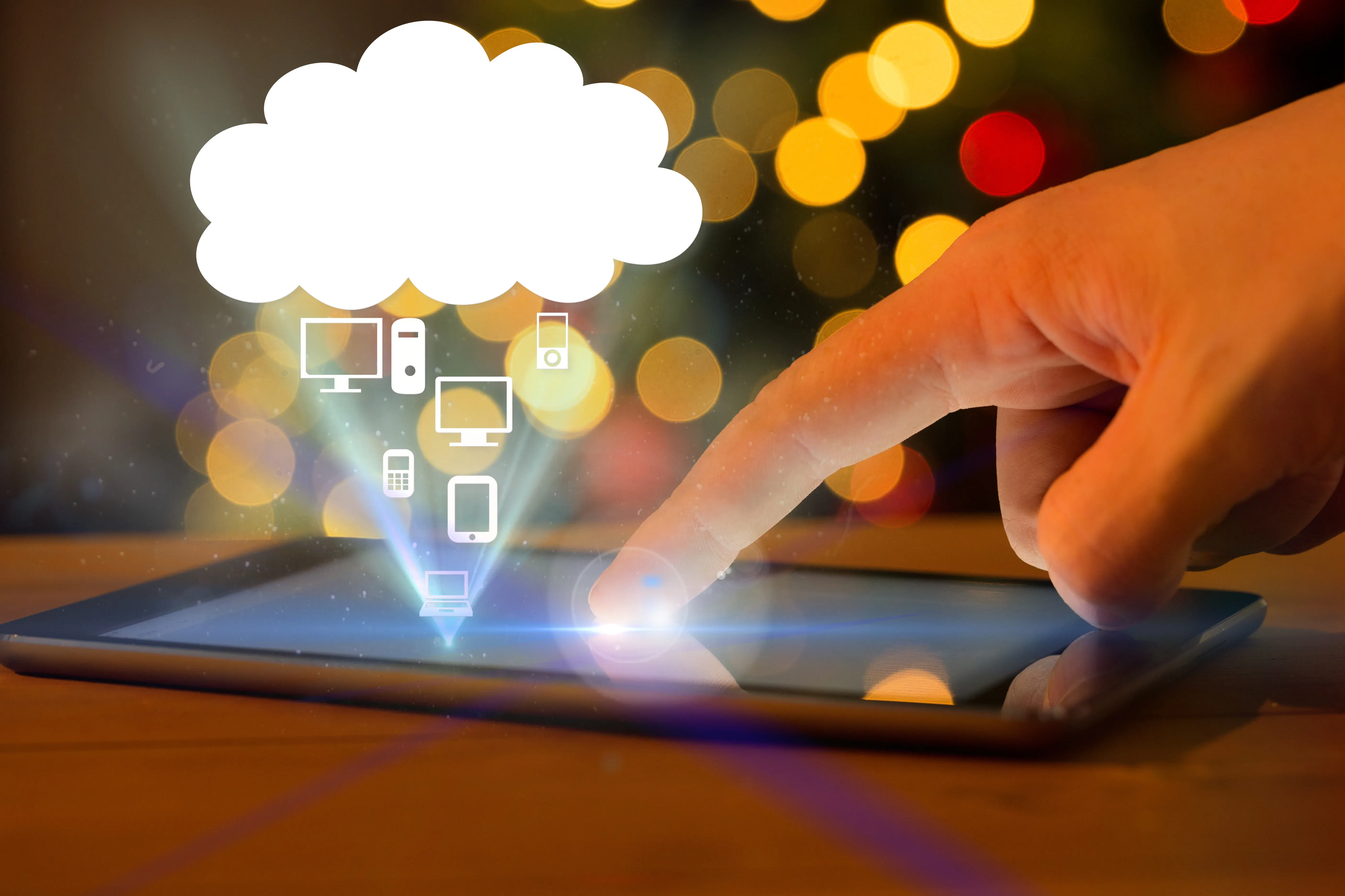 hand touching tablet screen for cloud-native development operations