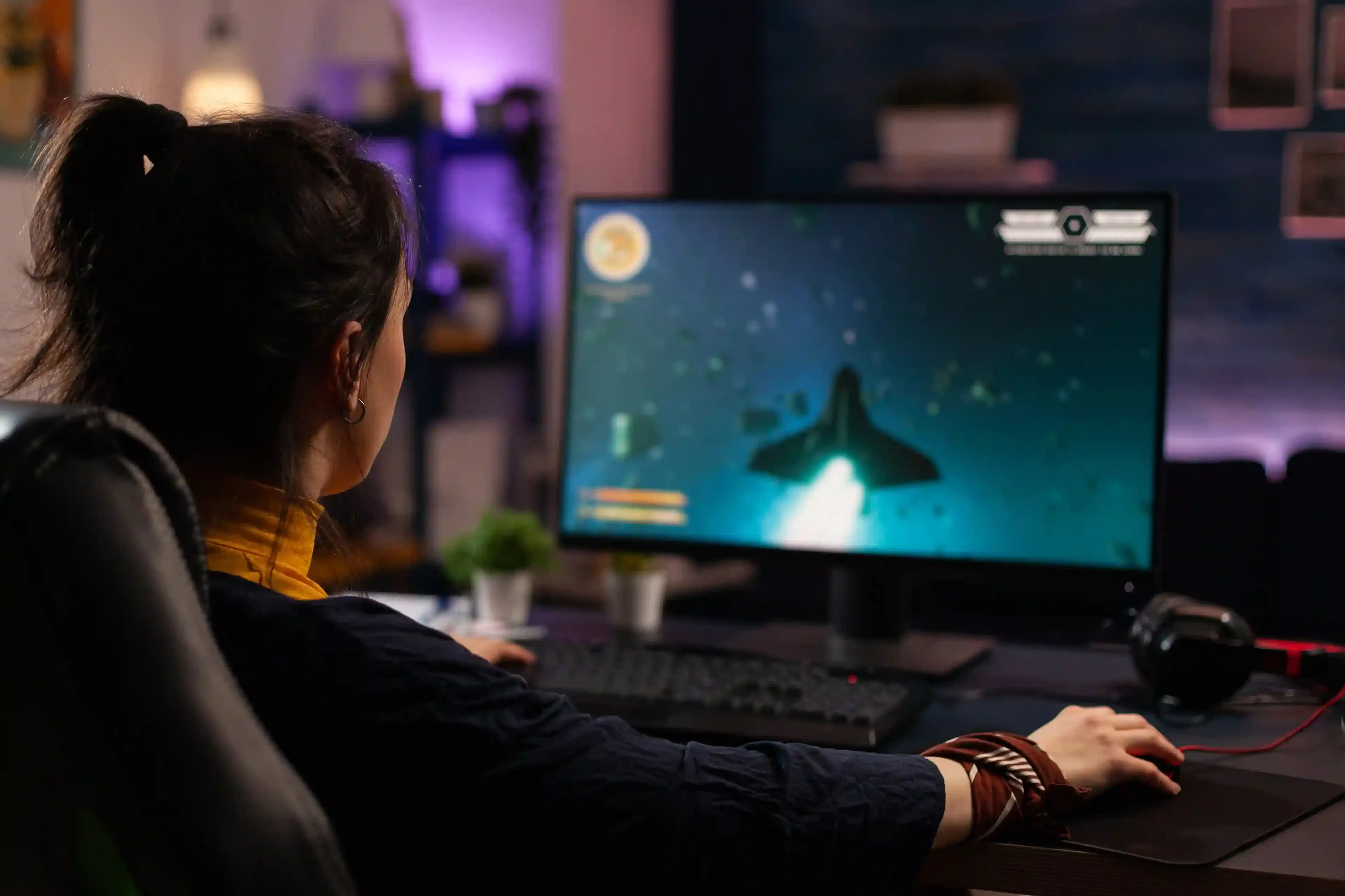 adult using keyboard and mousepad for PC gaming session