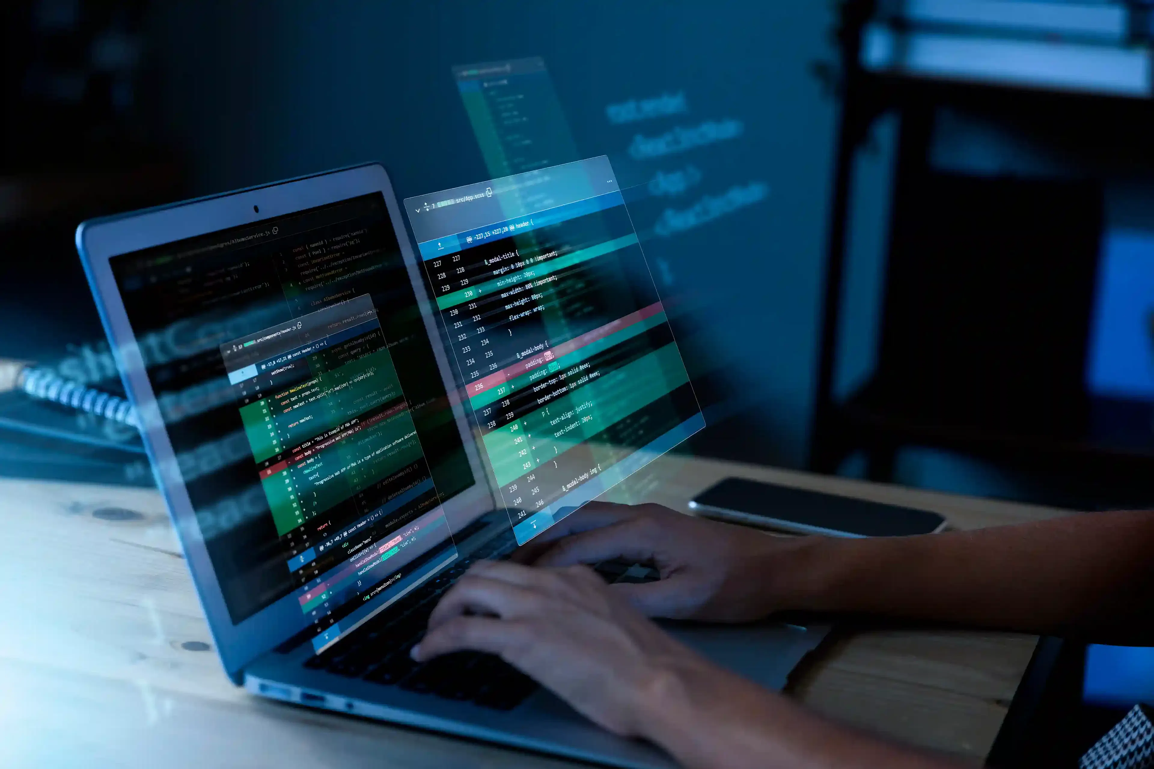 programmer working with code on computer screen