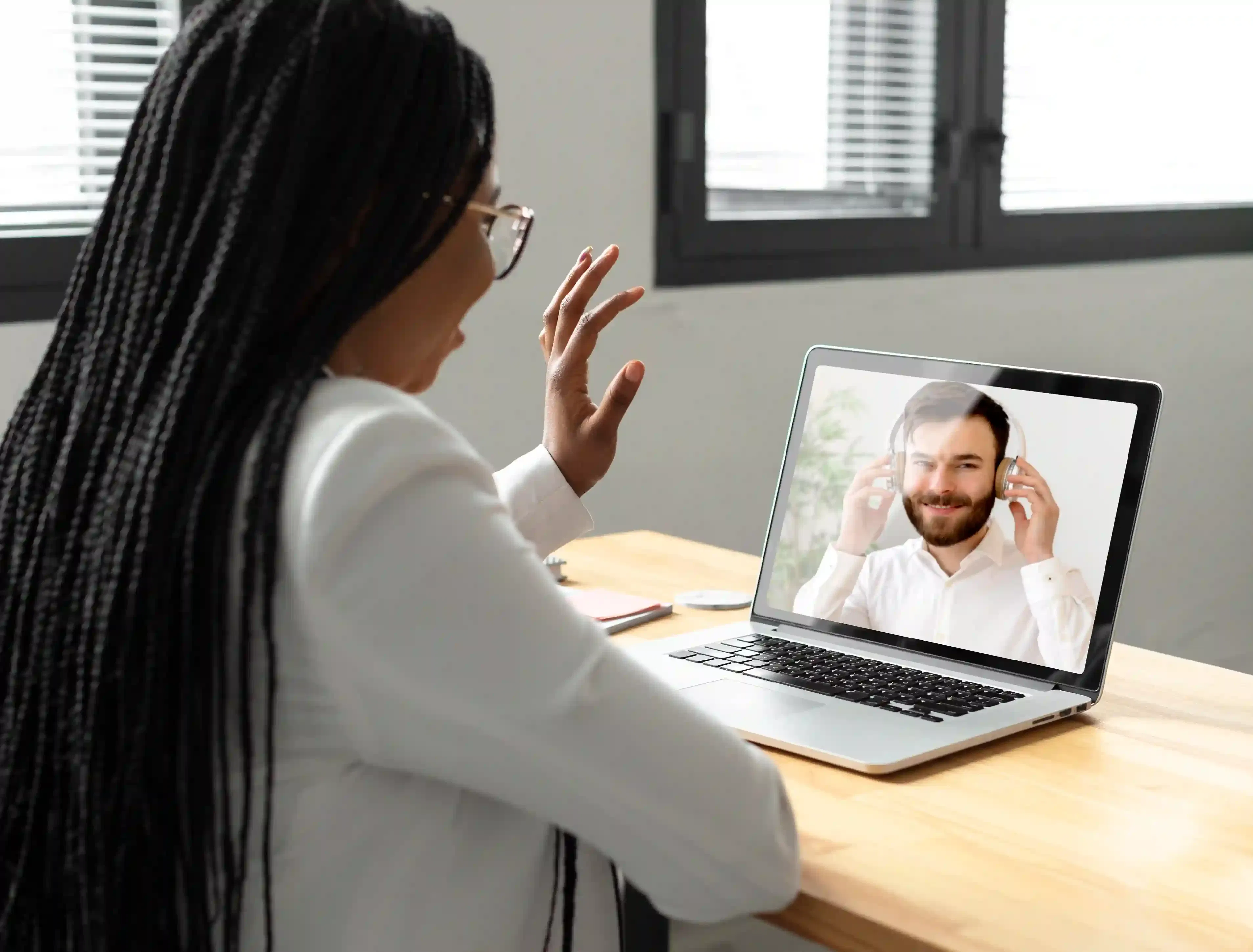 woman conducting video call interview on laptop
