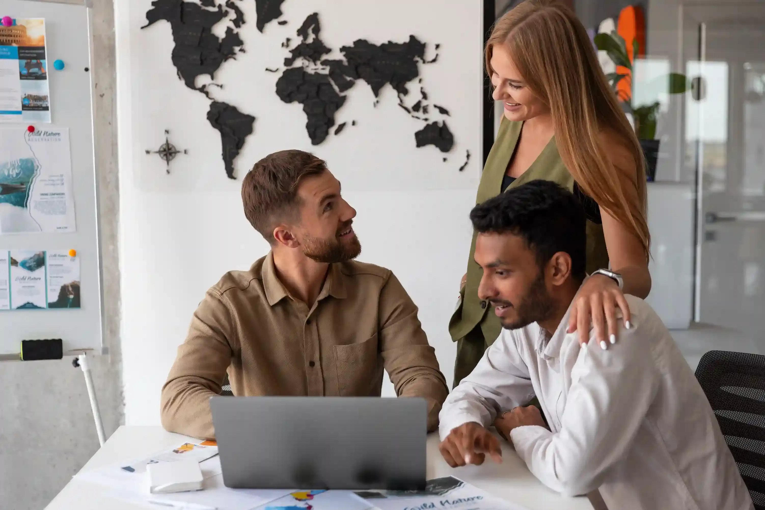 medium shot of professionals working in tech agency