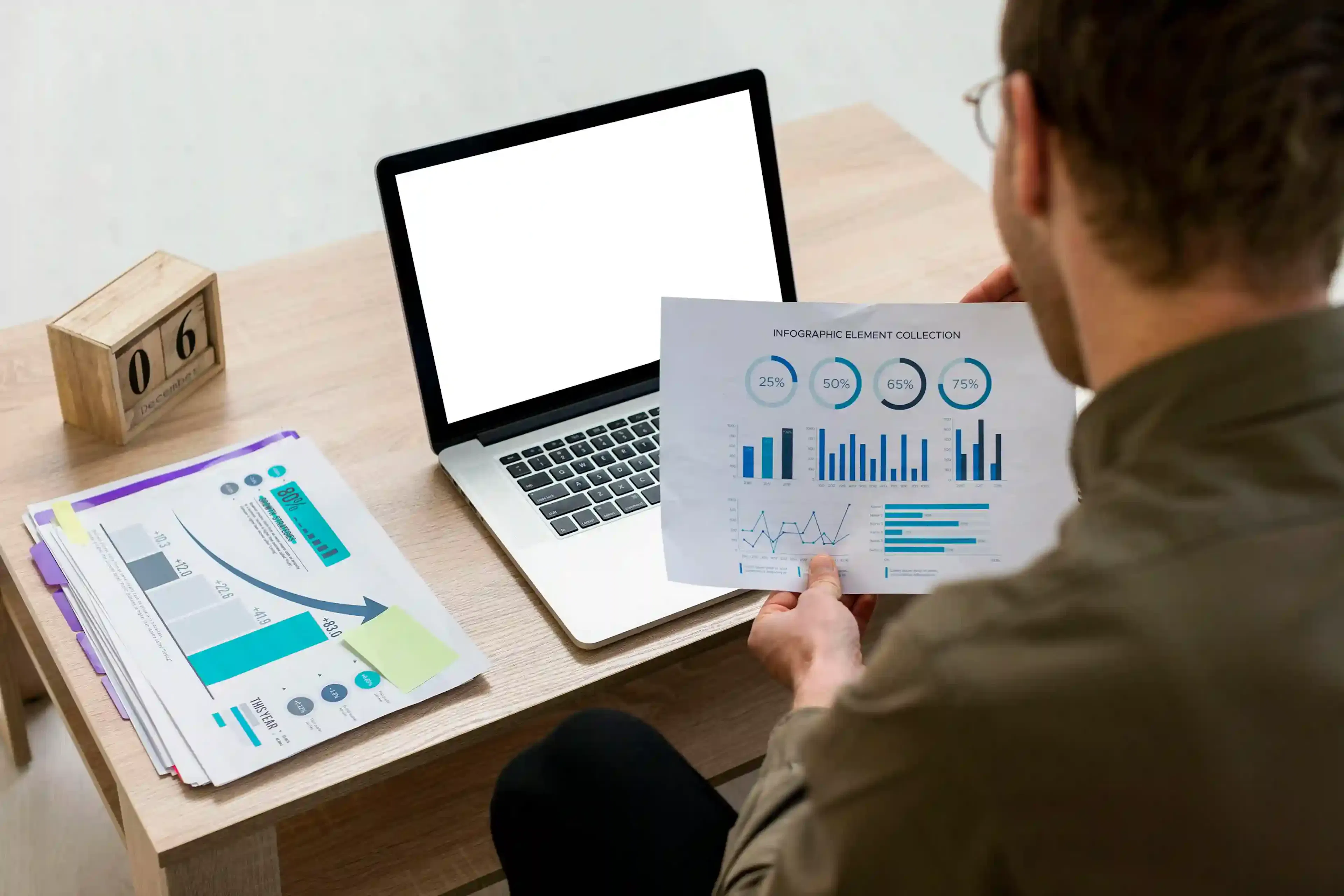 professional working with data infographics indoors