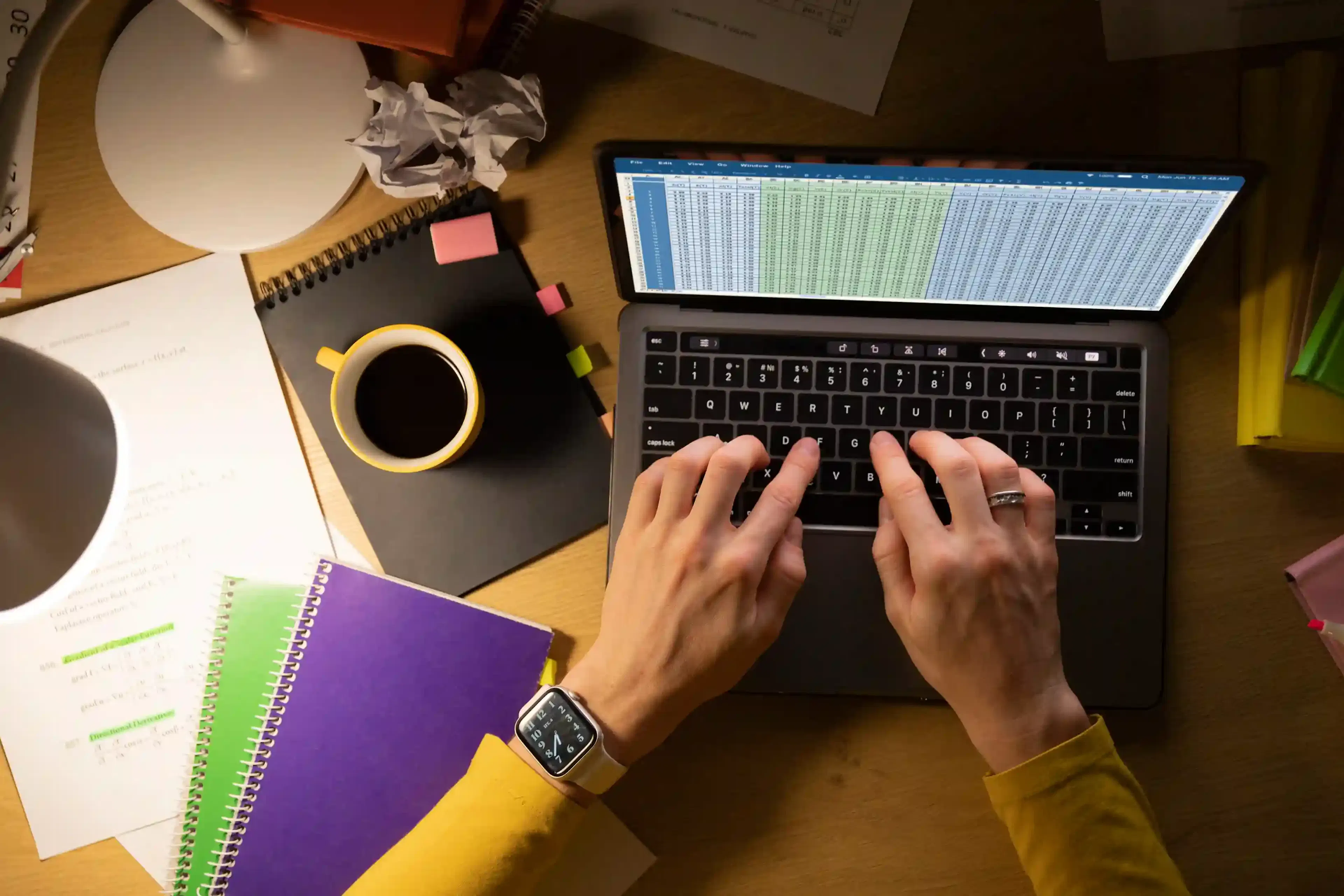 study materials and exam papers on desk for remote software development
