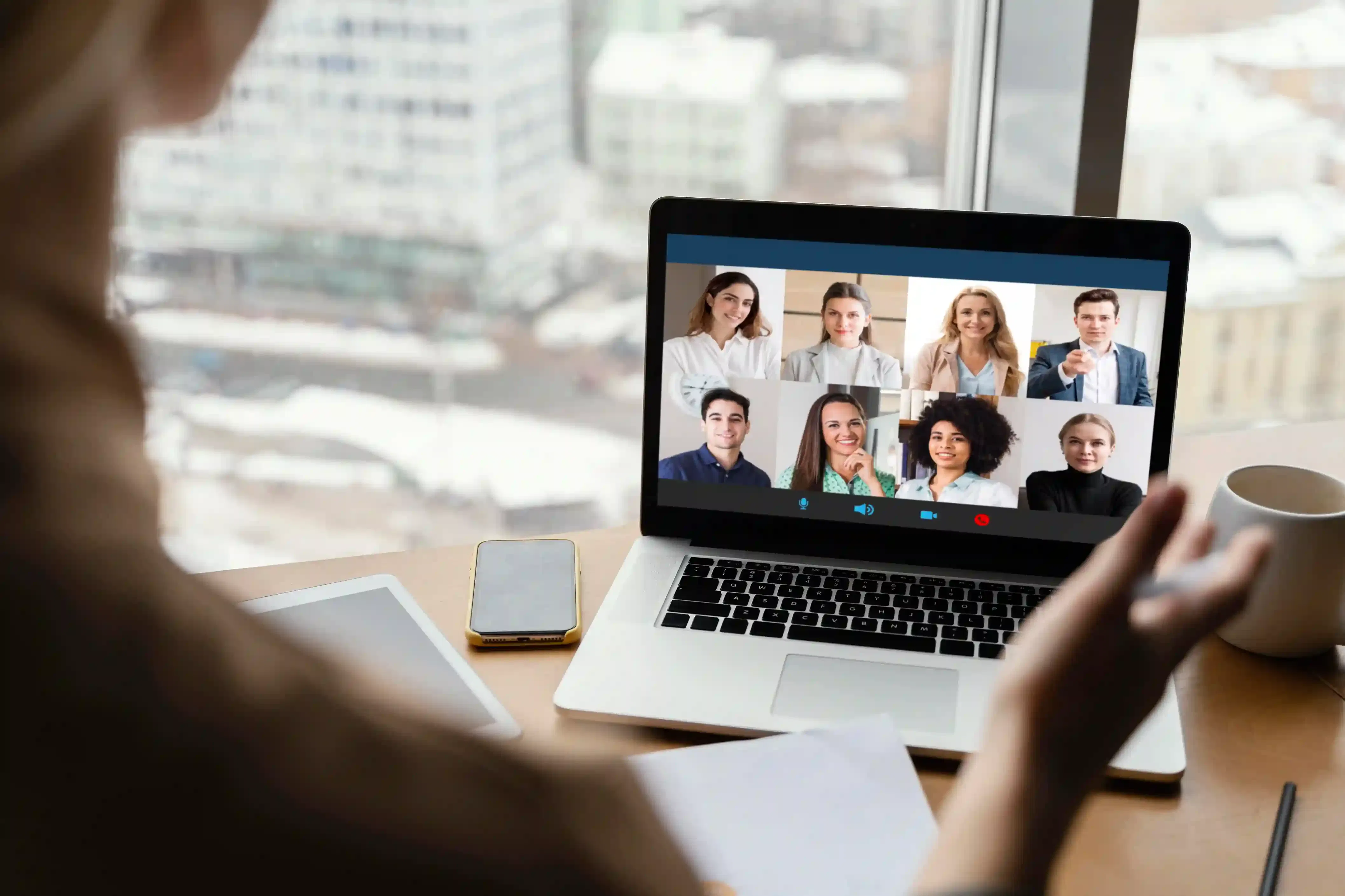 rear view of woman on a video call working remotely