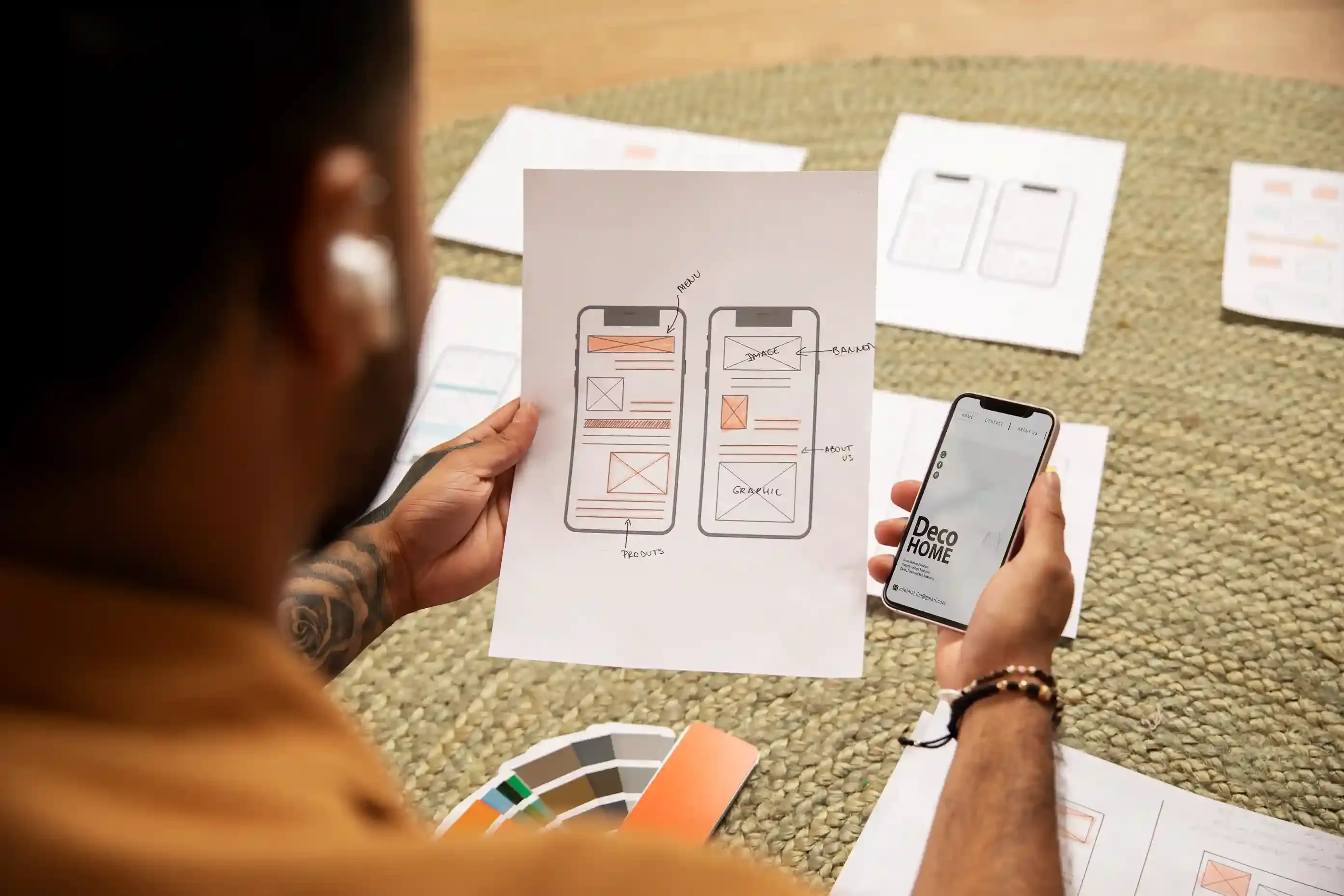 top-angle view of designer working with smartphone