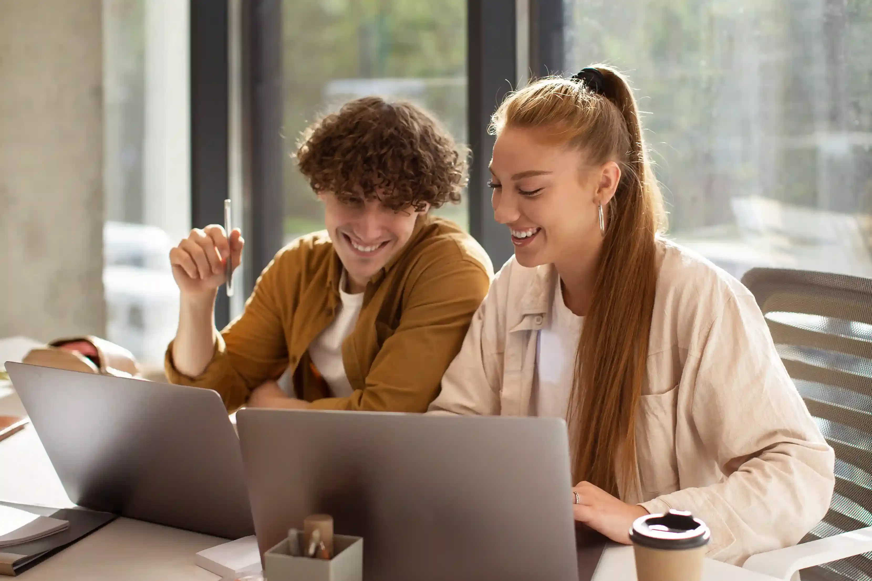 medium shot of software outsourcing professionals working on laptops