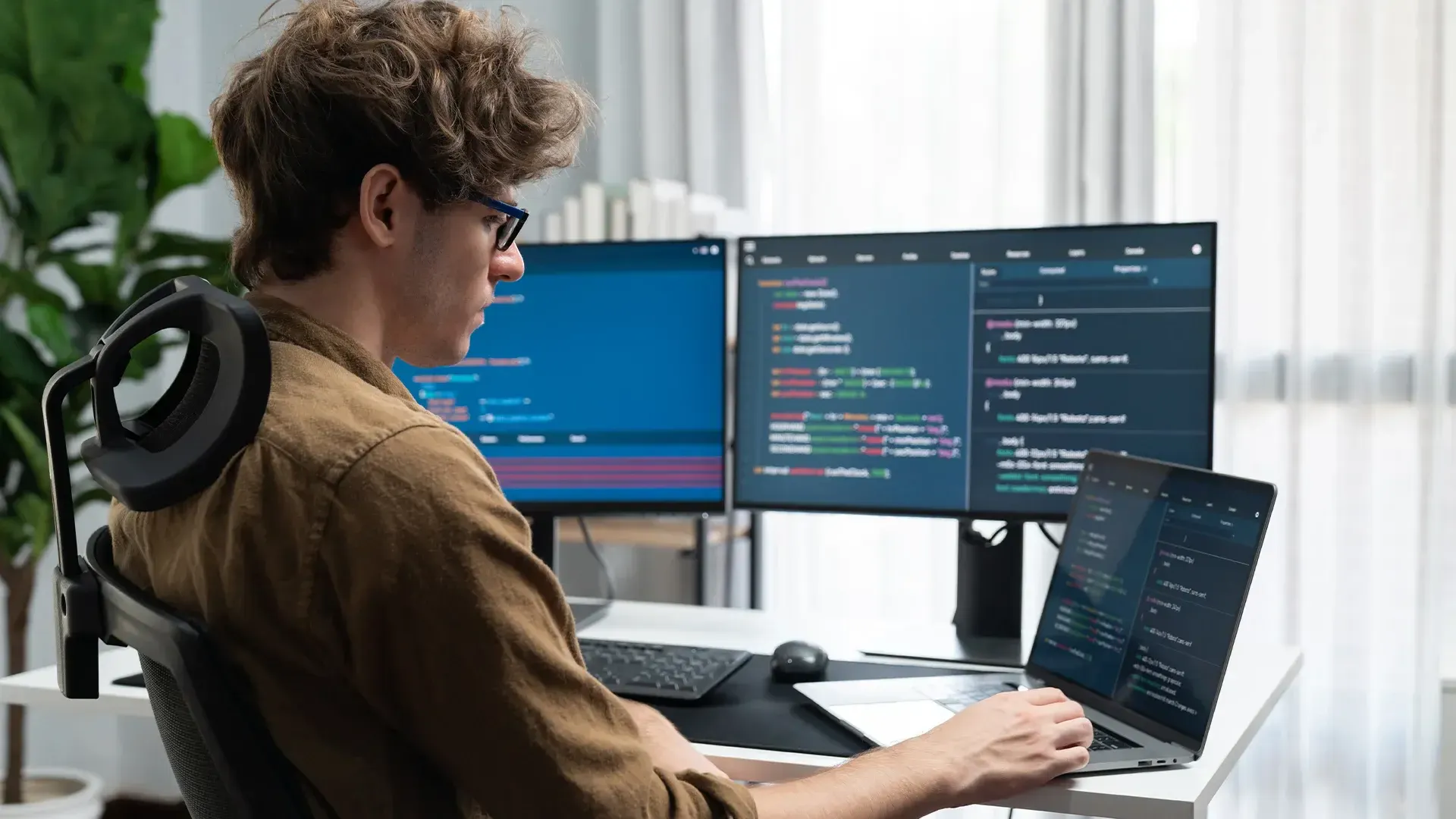 remote software development professional working on software project in modern office
