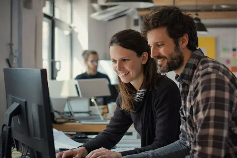AI-generated workplace scene showing software development