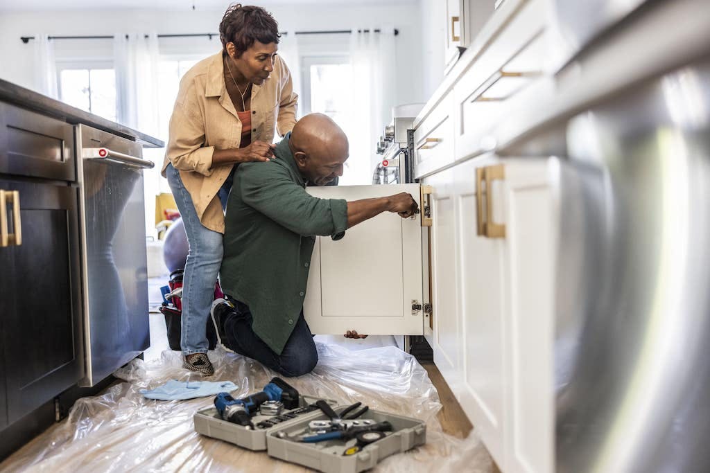 landlords performing an inspection in the kitchen