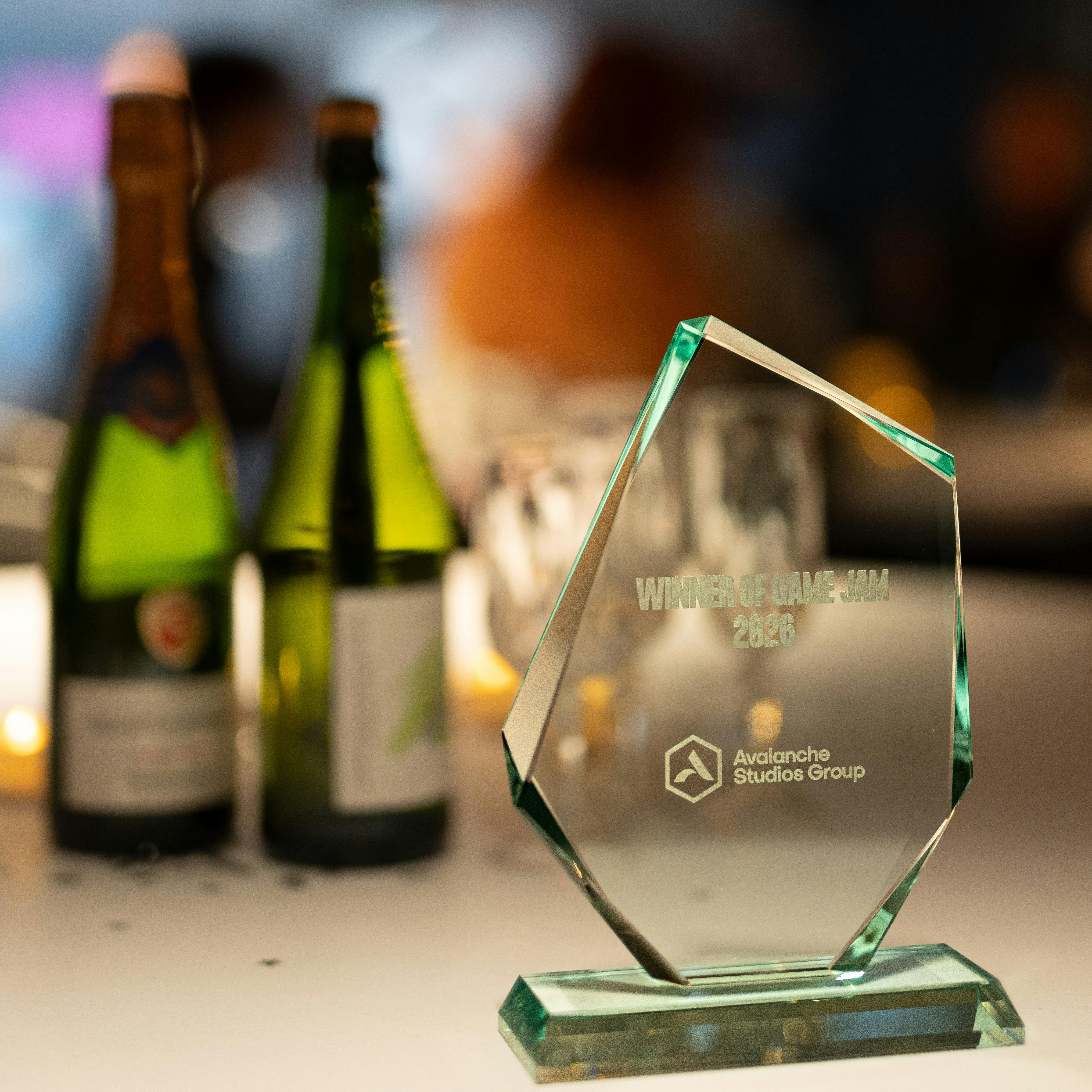 Clear glass award displayed upright on a table.
