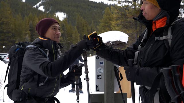Two AST students fist-bump at a transceiver check