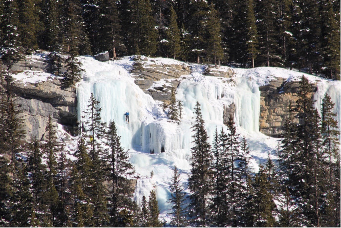 Waterfall ice with a climber ascending