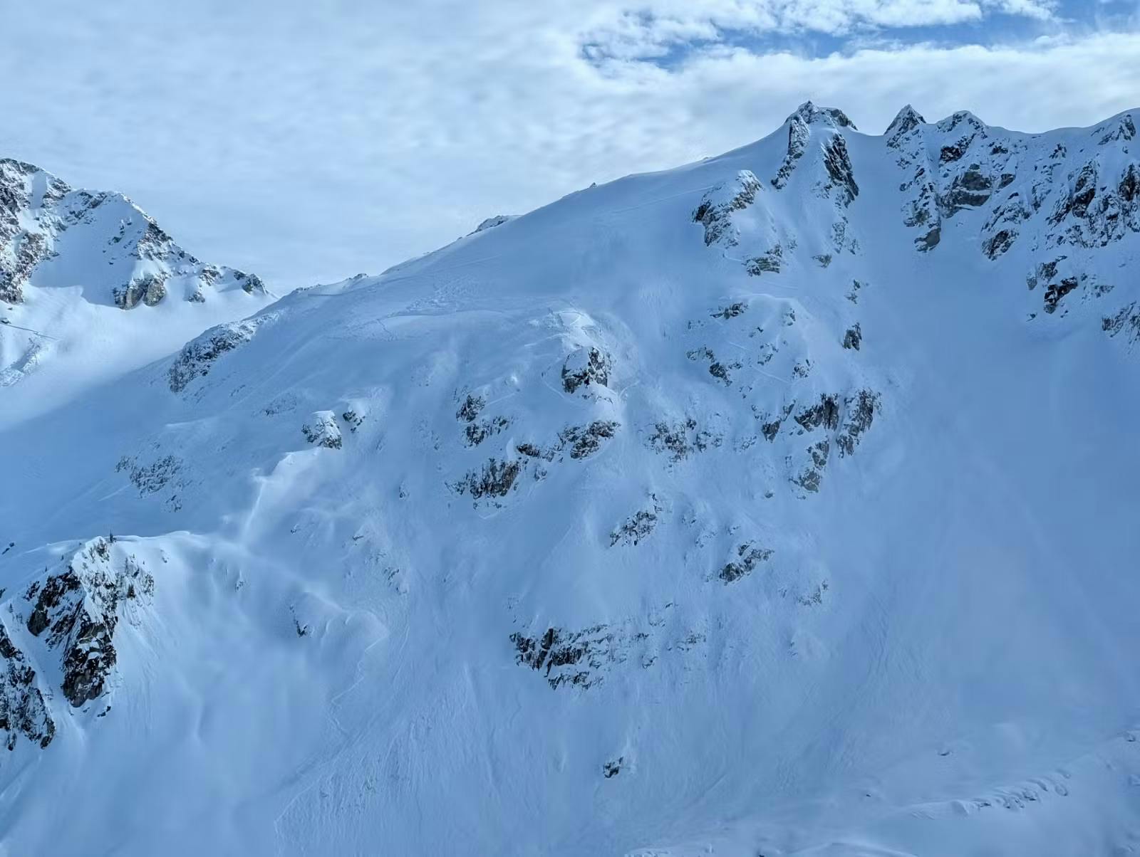 an avalanche that has propagated across features on steep alpine terrain