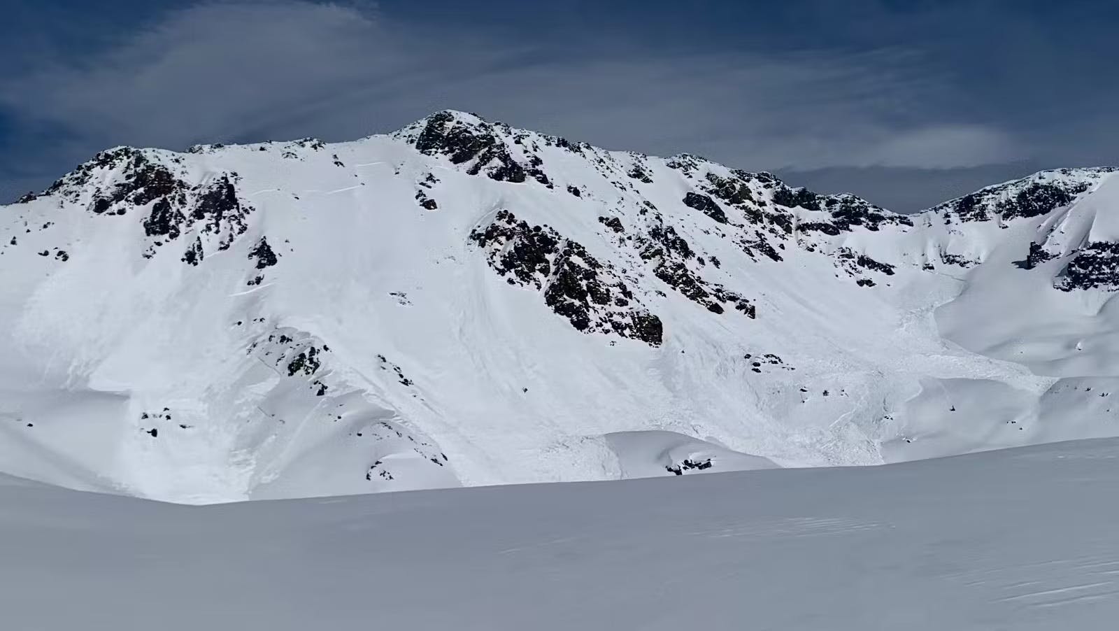 a large avalanche that has propagated across a variety of alpine terrain features